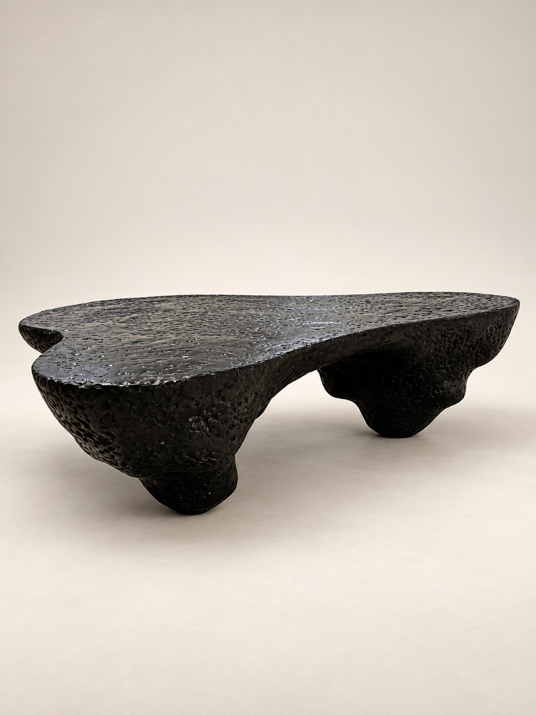 Front view of Insula collectible design coffee table by Justino Del Casar in textured black finish