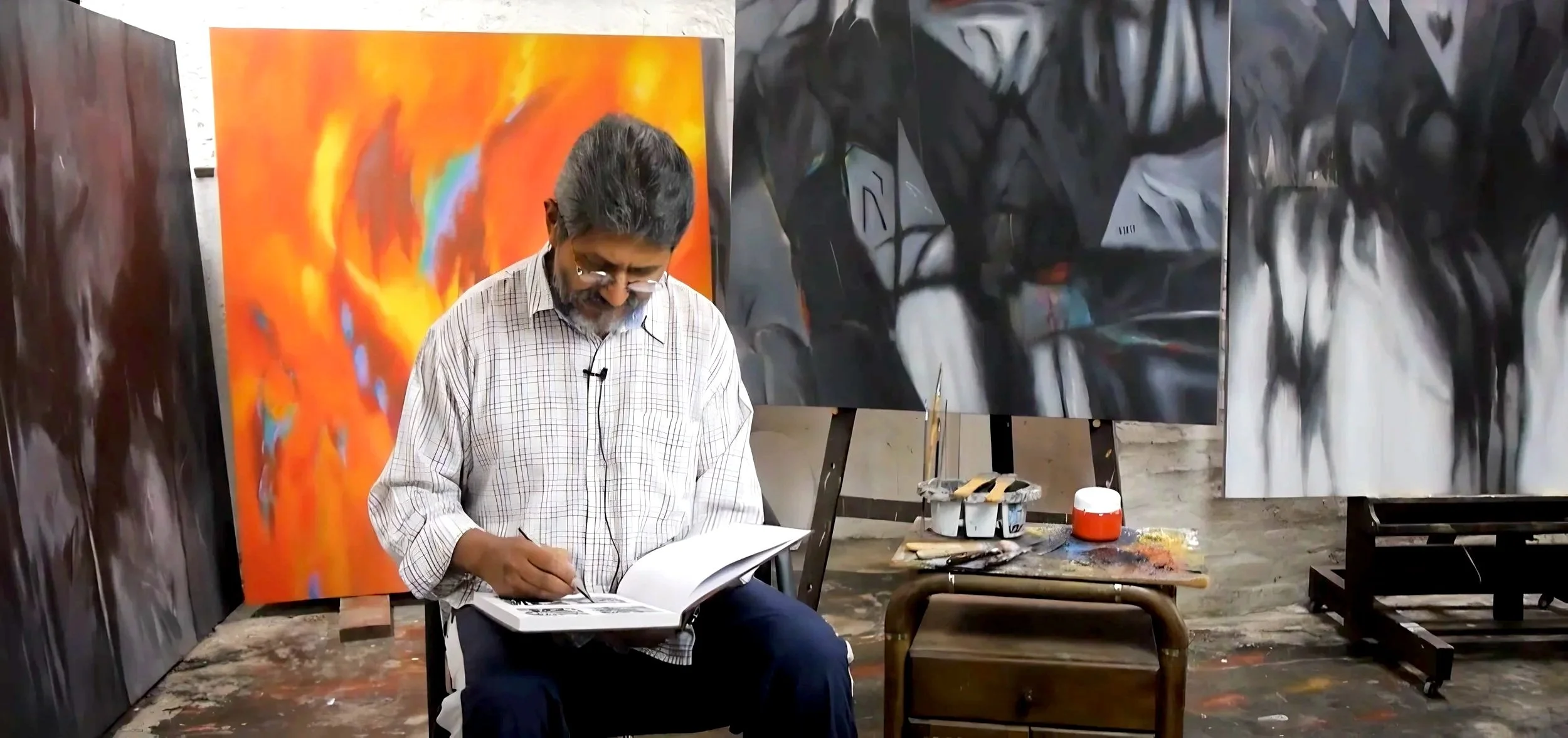 Colombian contemporary artist Jimmy Lenis painting abstract artwork in studio