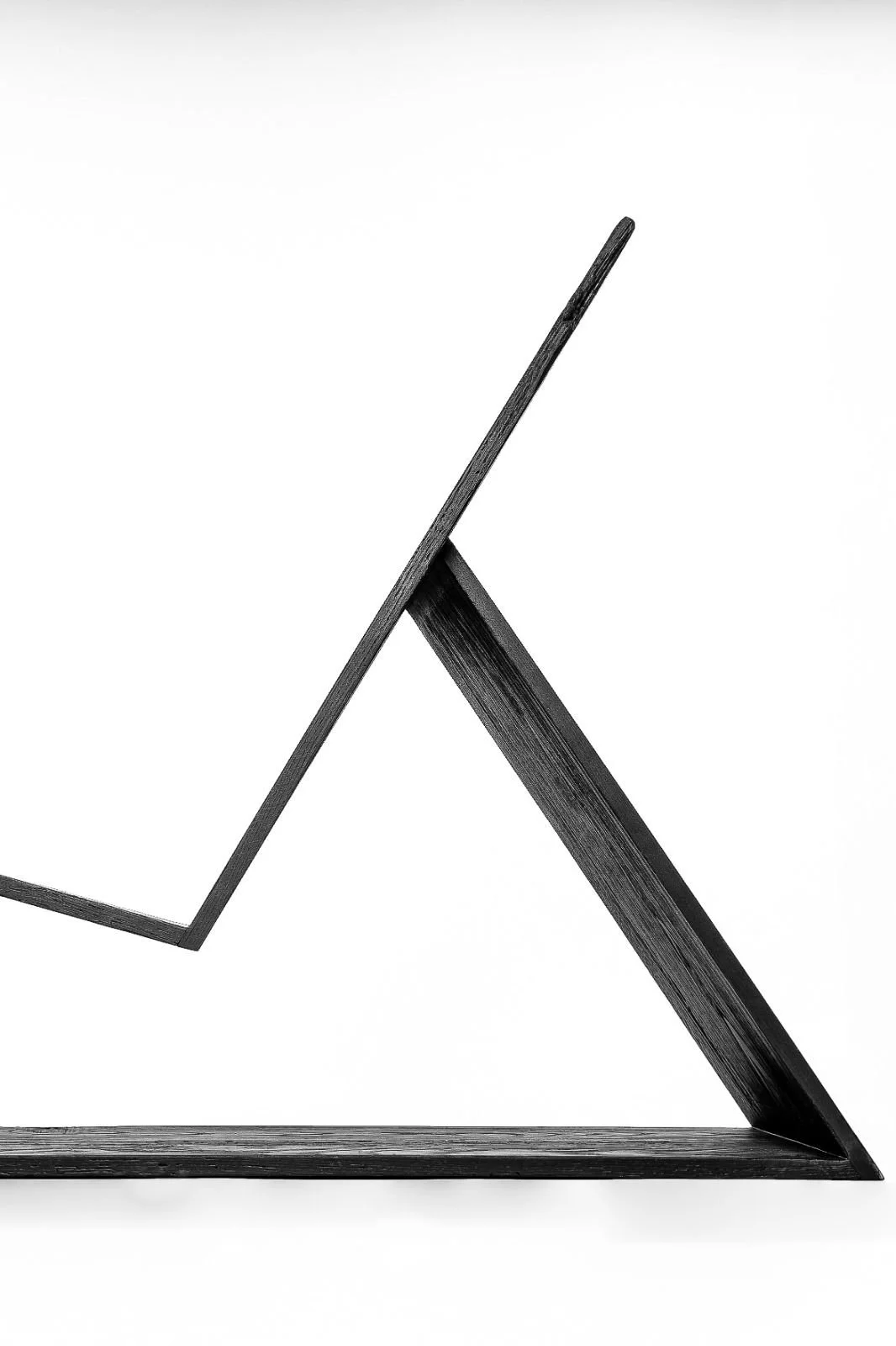 Minimalist collectible lounge chair Chloe by Minimal Studio in carbonized finish