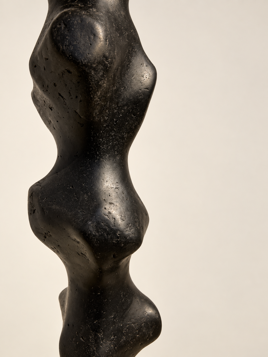 Detail of Tótem II by Justino Del Casar showing the speckled texture of hand-polished papier-mâché