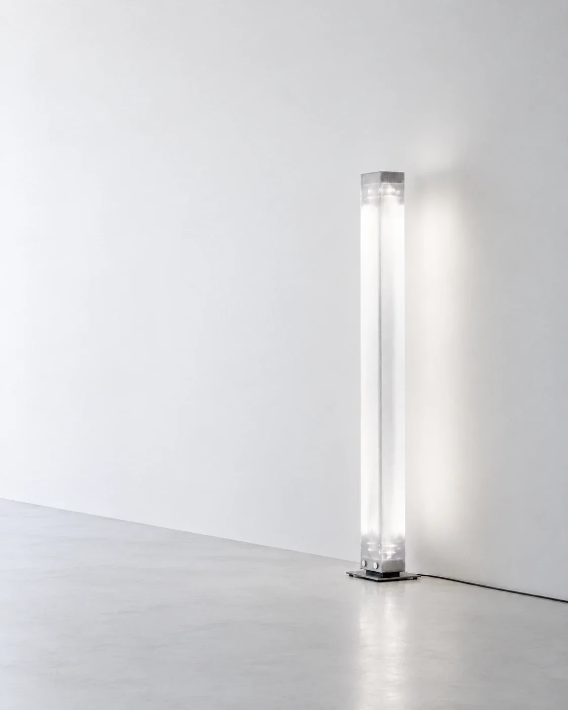 Belux Twilight floor lamp in stainless steel, a glowing column of light in a bright white minimalist space