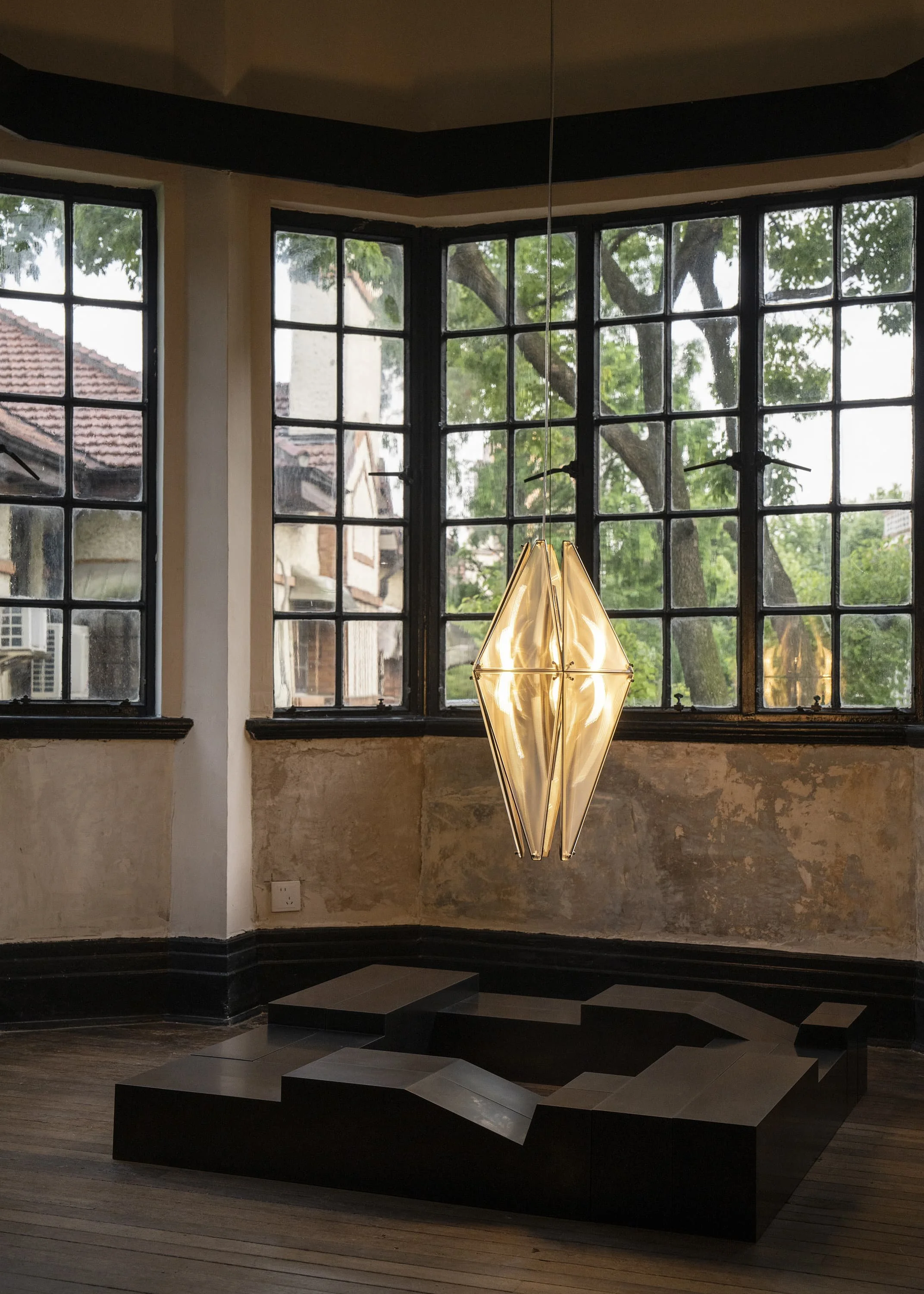 Warm illuminated pendant lamp Fragment 08 at EAST WEST SPACE showroom.