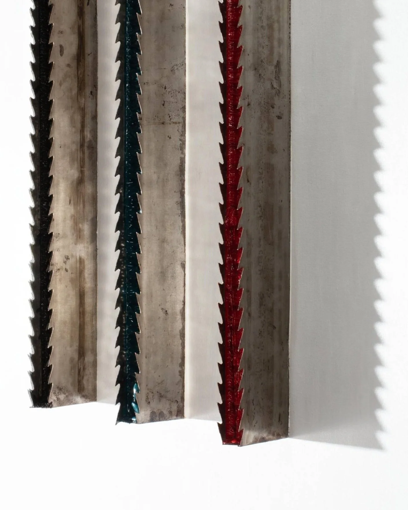 Chen Wencai Threshold Line II with red green and black lacquered saw blades in EAST WEST SPACE