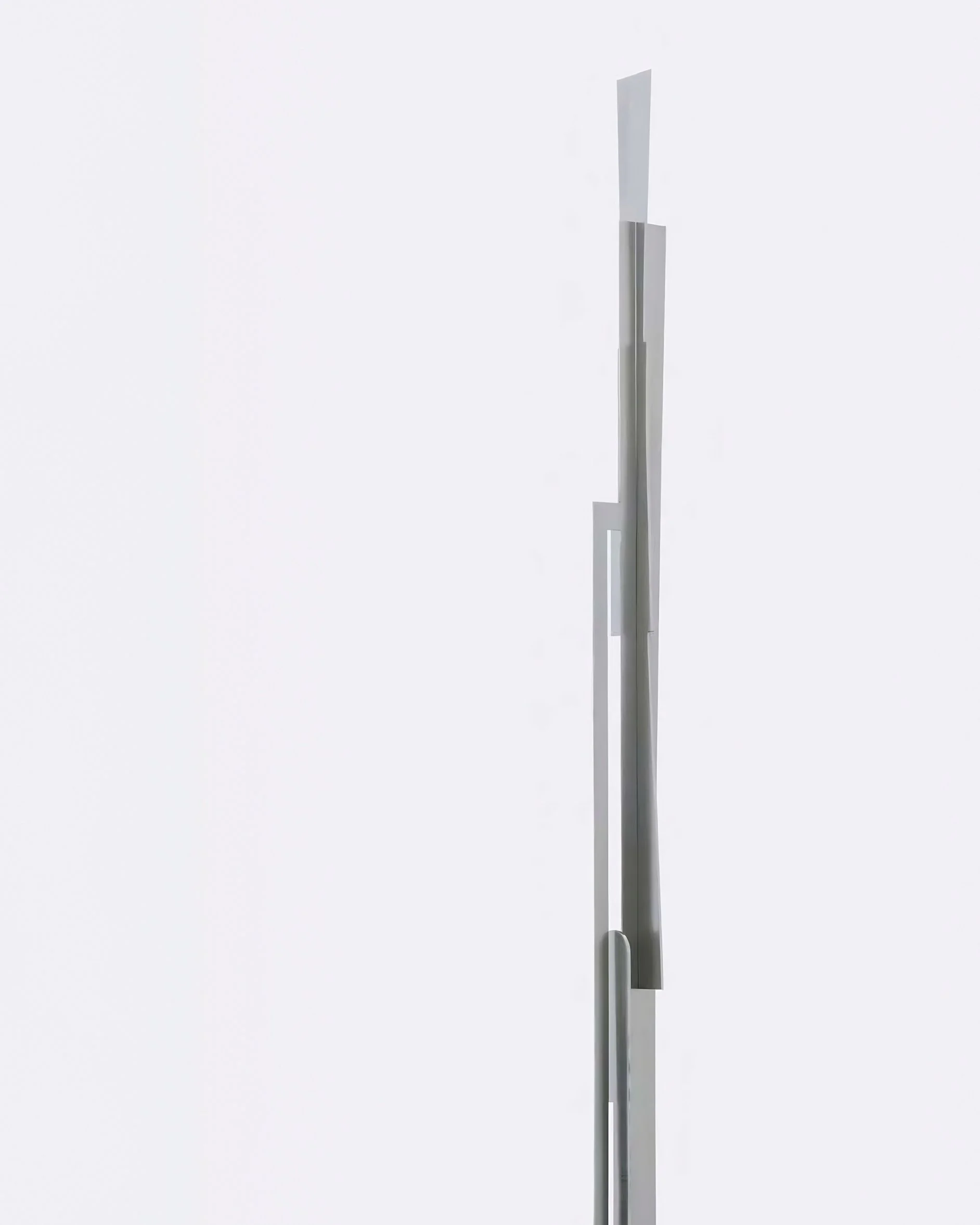 Contemporary collectible steel and wood sculpture with geometric planes, Totem N5.