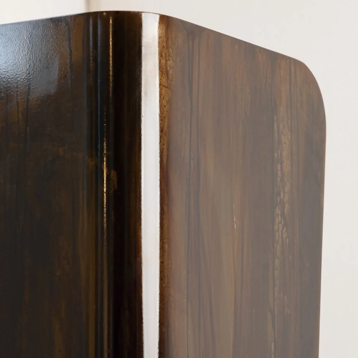 Modern statement lighting piece with organic geometric silhouette for luxury interiors.