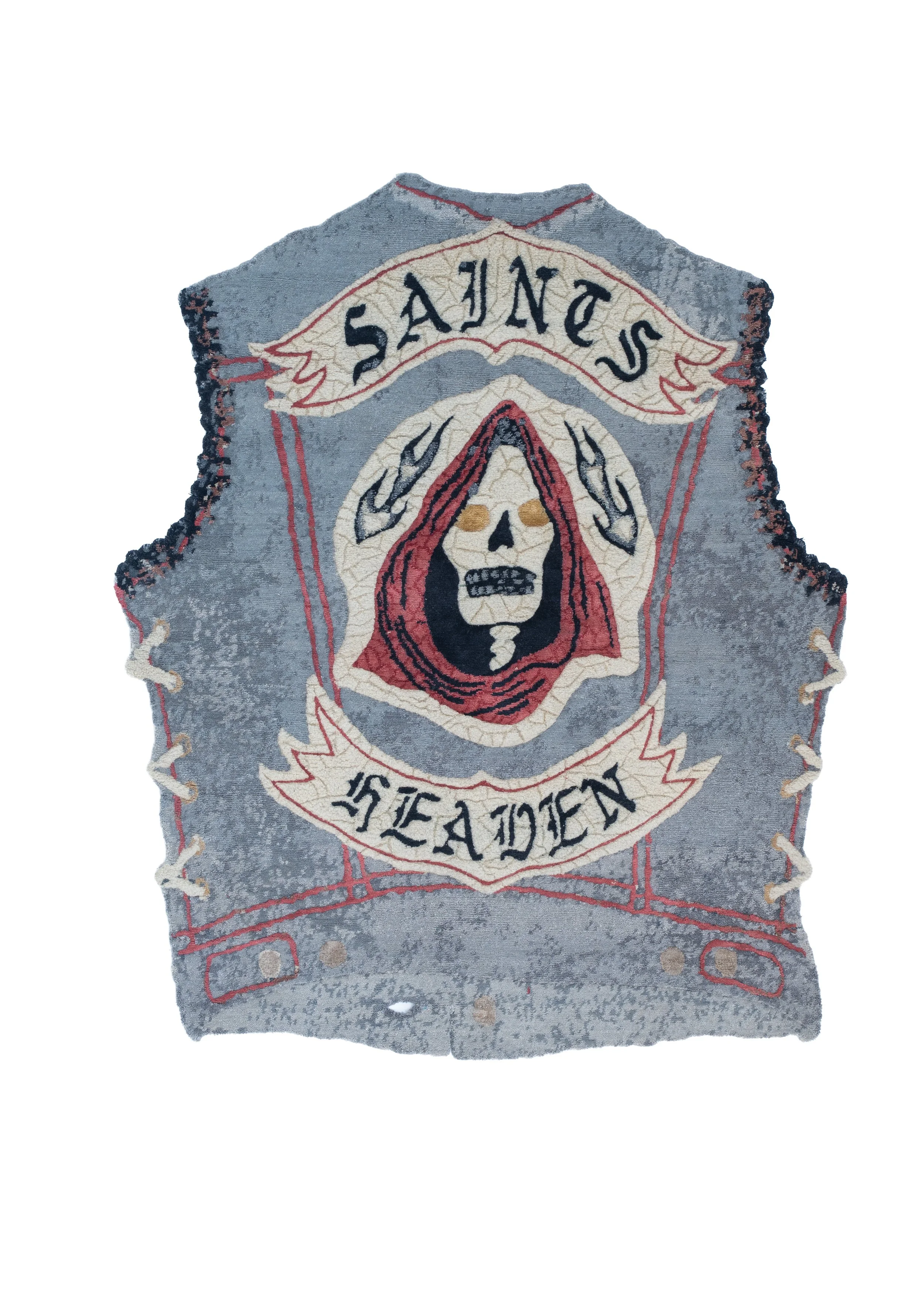 Top view of Saints by Julien Jaca folded over: hand-knotted pile in wool, silk, alpaca and nettle with skull, flames and red stitching, available in BLANCONEGRO BARCELONA