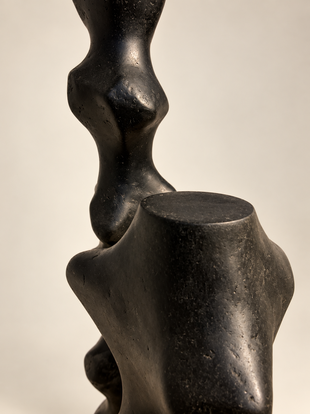 Detail of Tótem I and Tótem II by Justino Del Casar, biomorphic black totem sculptures side by side