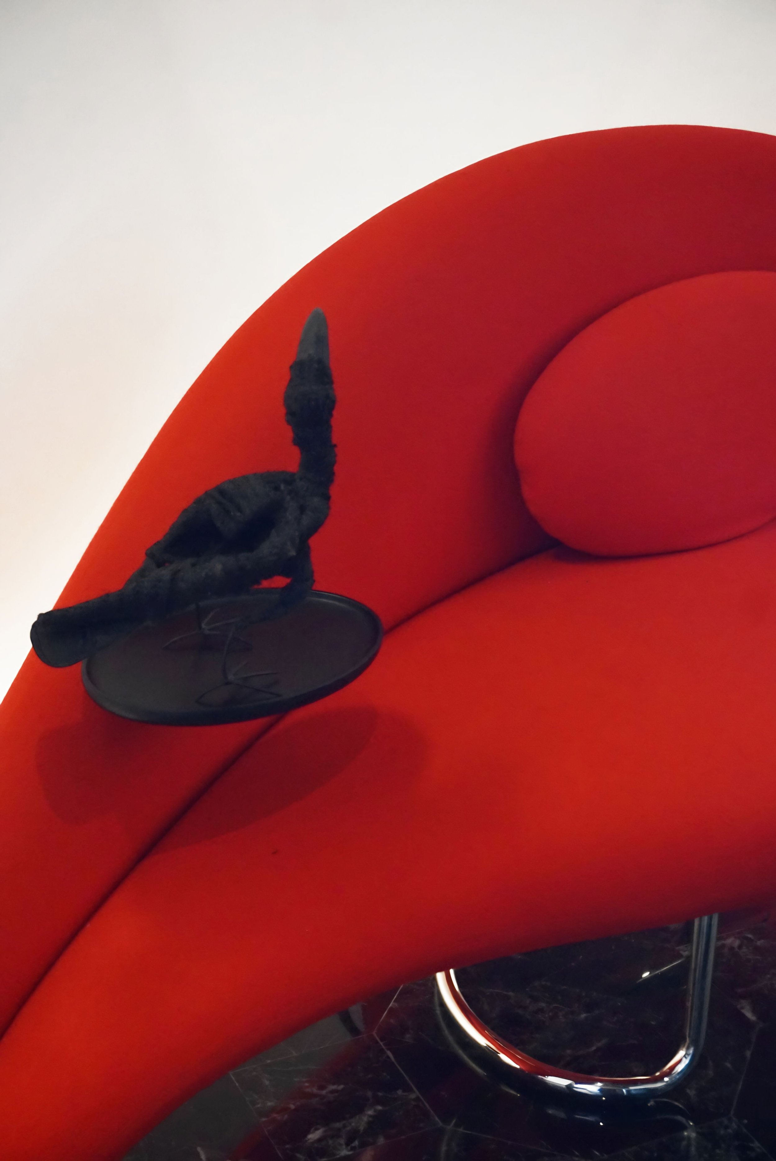 Sculptural red Fun Bench with asymmetrical curved form