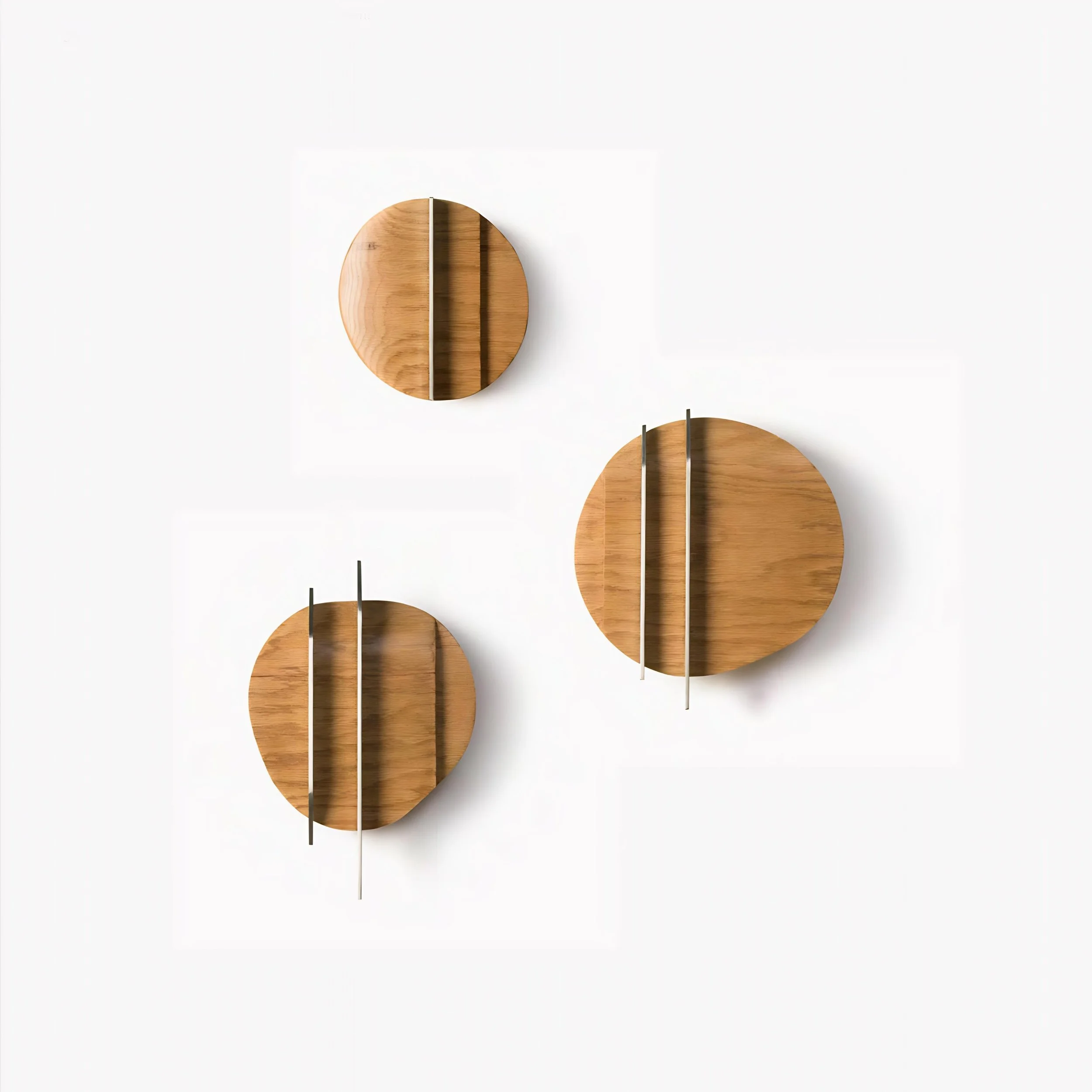 Minimalist wall sculpture set combining warm wood textures and refined vertical metal lines.