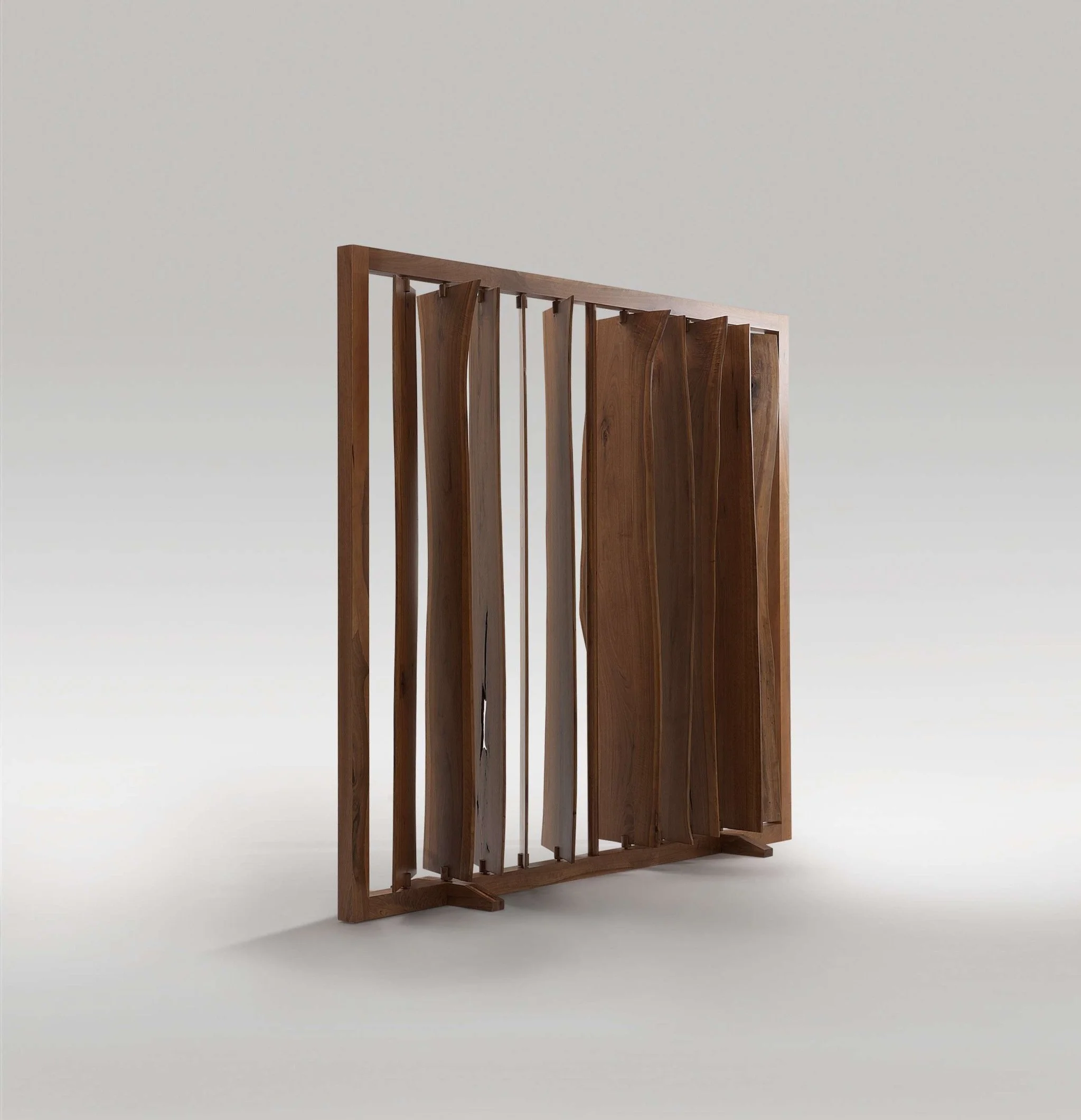 Walnut screen with organic vertical slats creating mist-like visual effects.