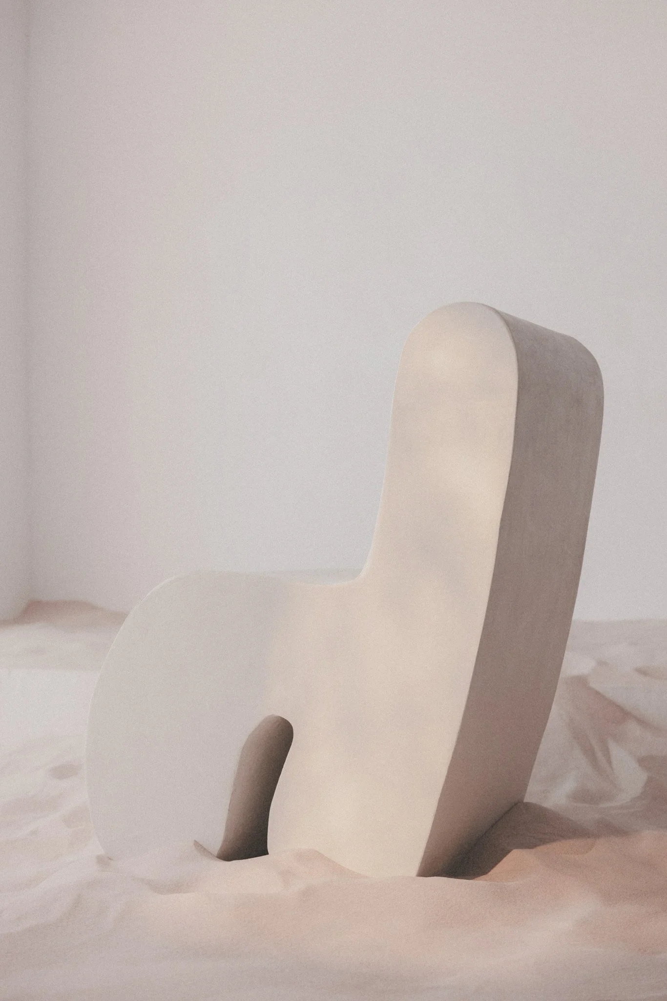Microcement sculptural chair combining tactile materiality and contemporary furniture design designed in Barcelona