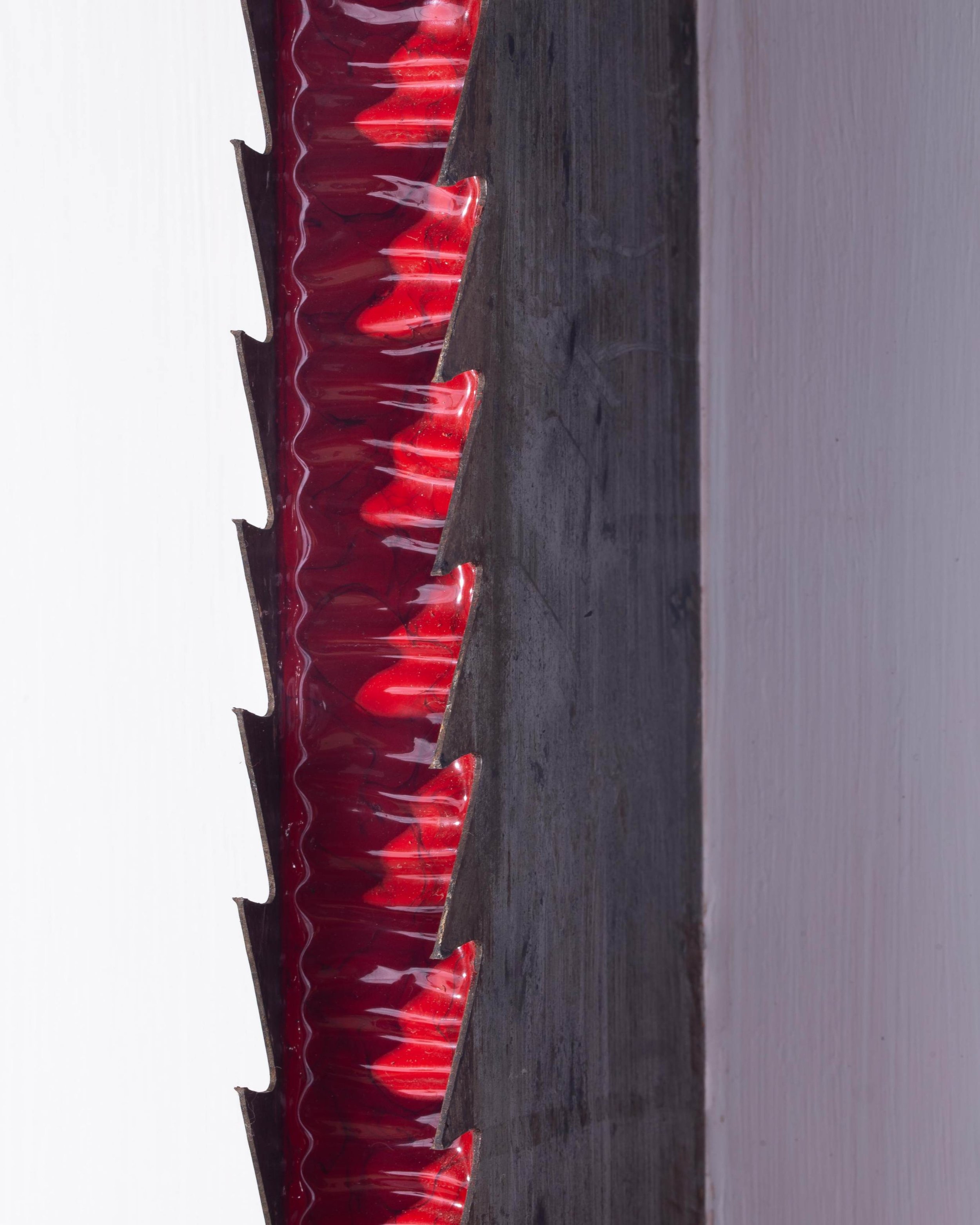 Detail of Threshold Line I showing red Chinese lacquer applied to industrial saw blade