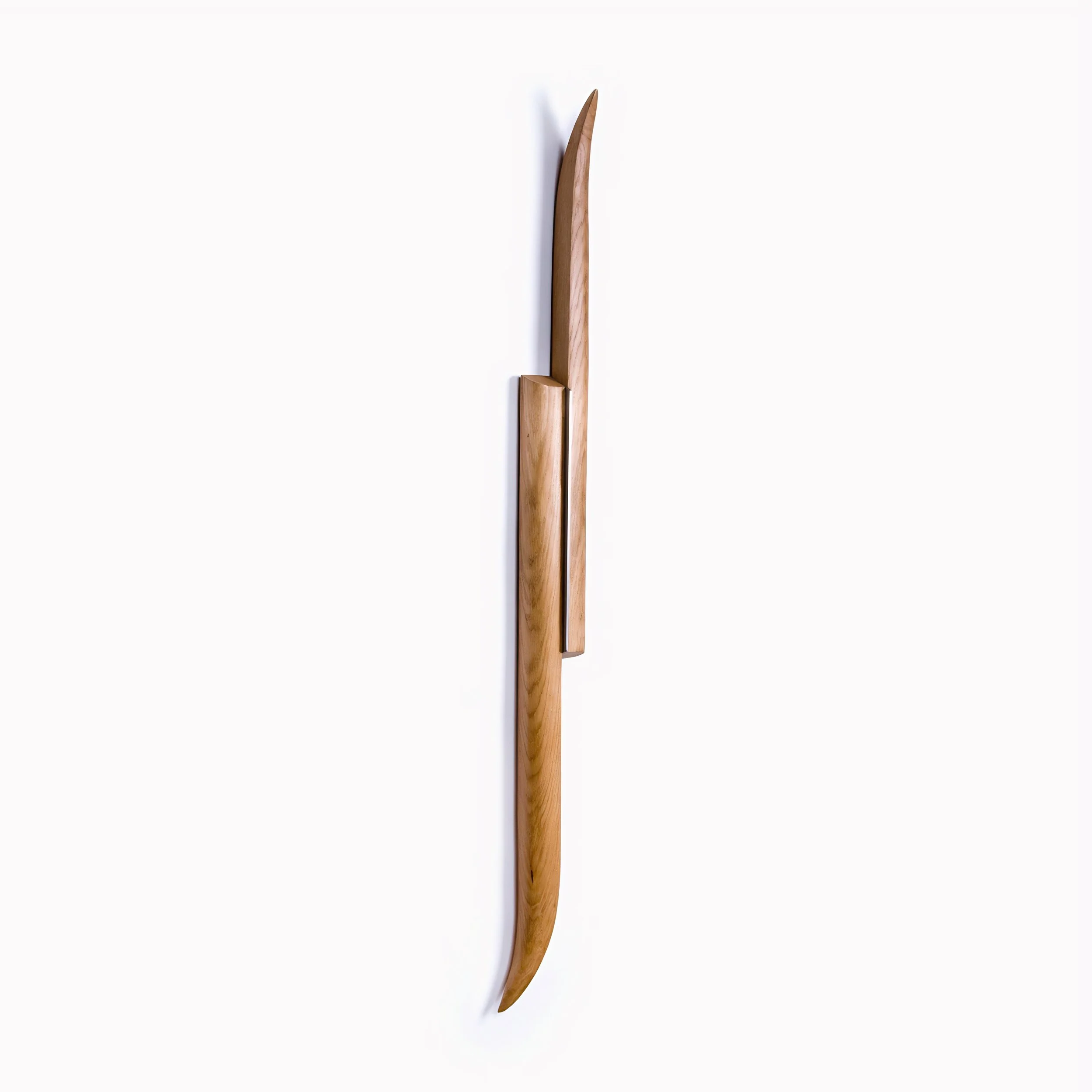 Contemporary wood artwork with flowing elongated form for modern interior design.