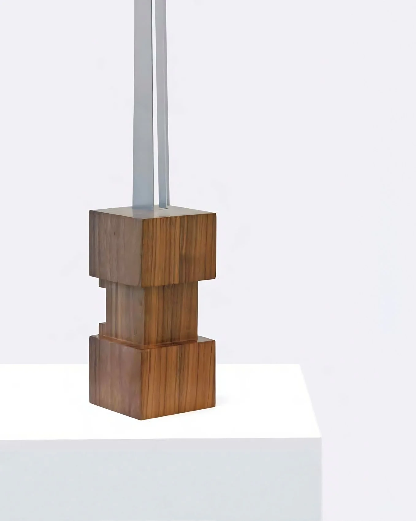 Contemporary collectible sculpture combining polished steel and walnut wood, Totem N3.