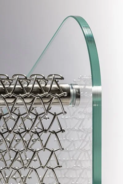 Detail of Metal Affaire armchair showing metal mesh seat by Minimal Studio