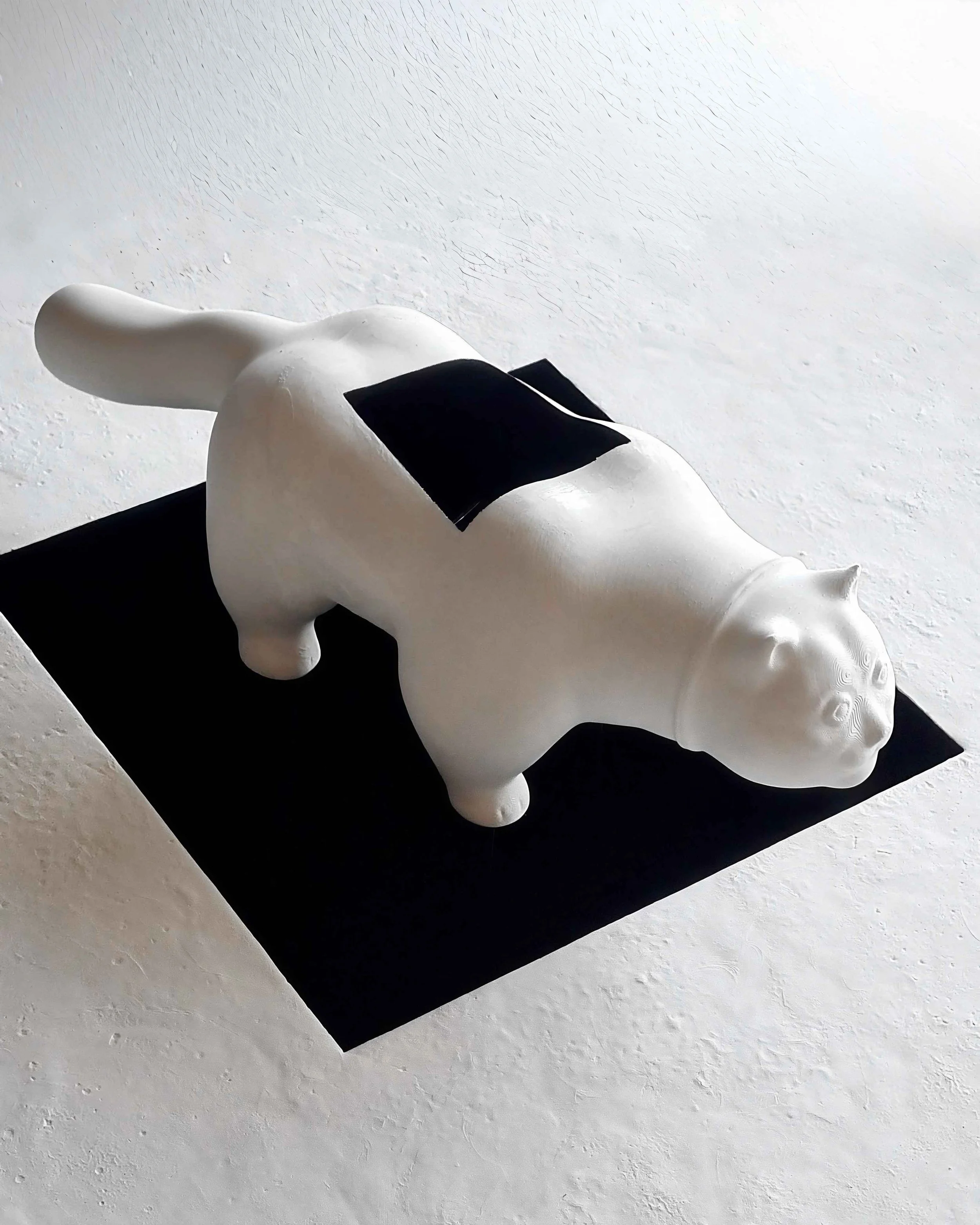 Reworked version of Botero’s Cat by Robert Pous featuring a geometric void across the sculpture.