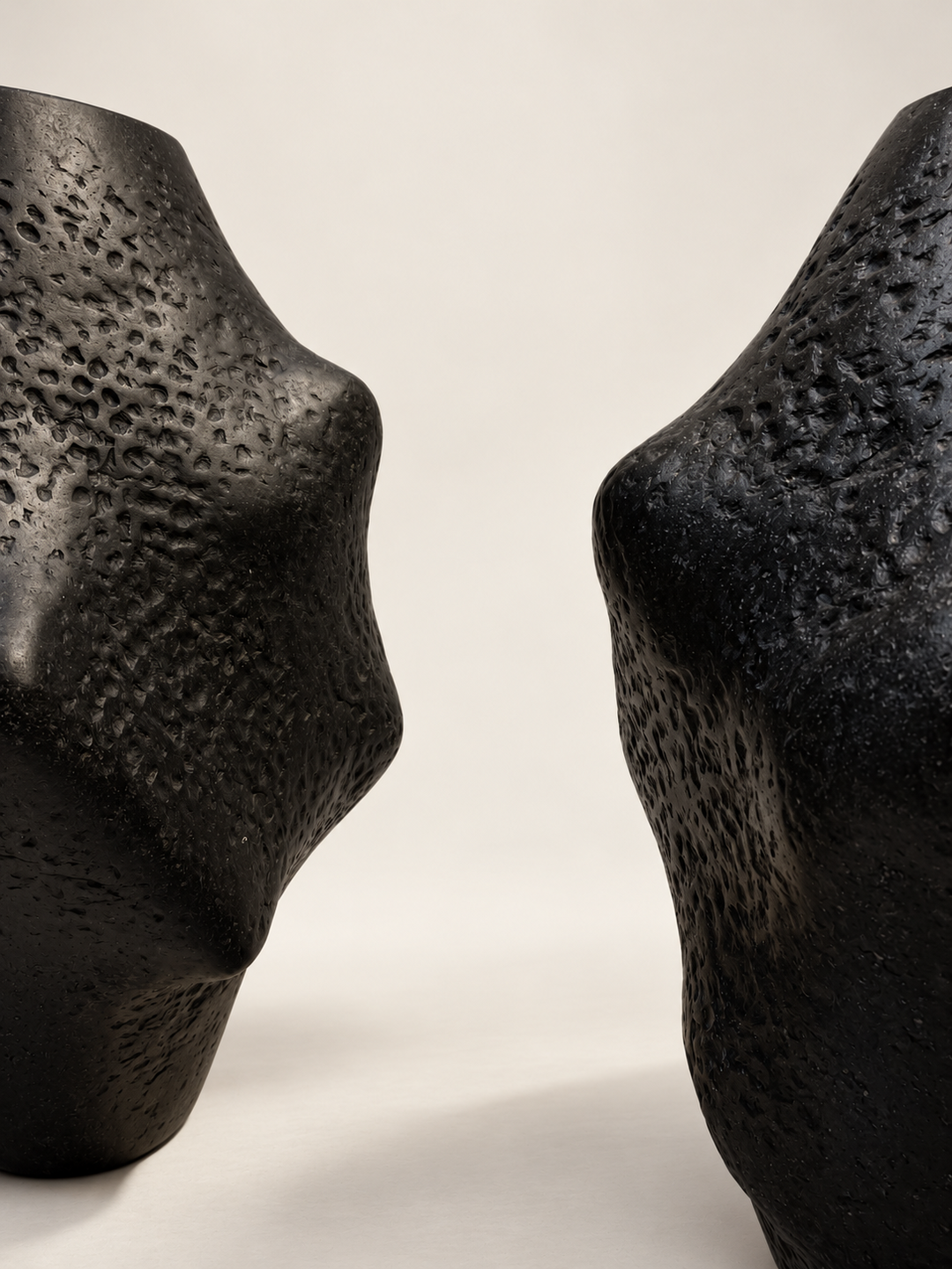 Close-up of the sculpted curves of Charta Ollam by Justino Del Casar in textured black papier-mâché