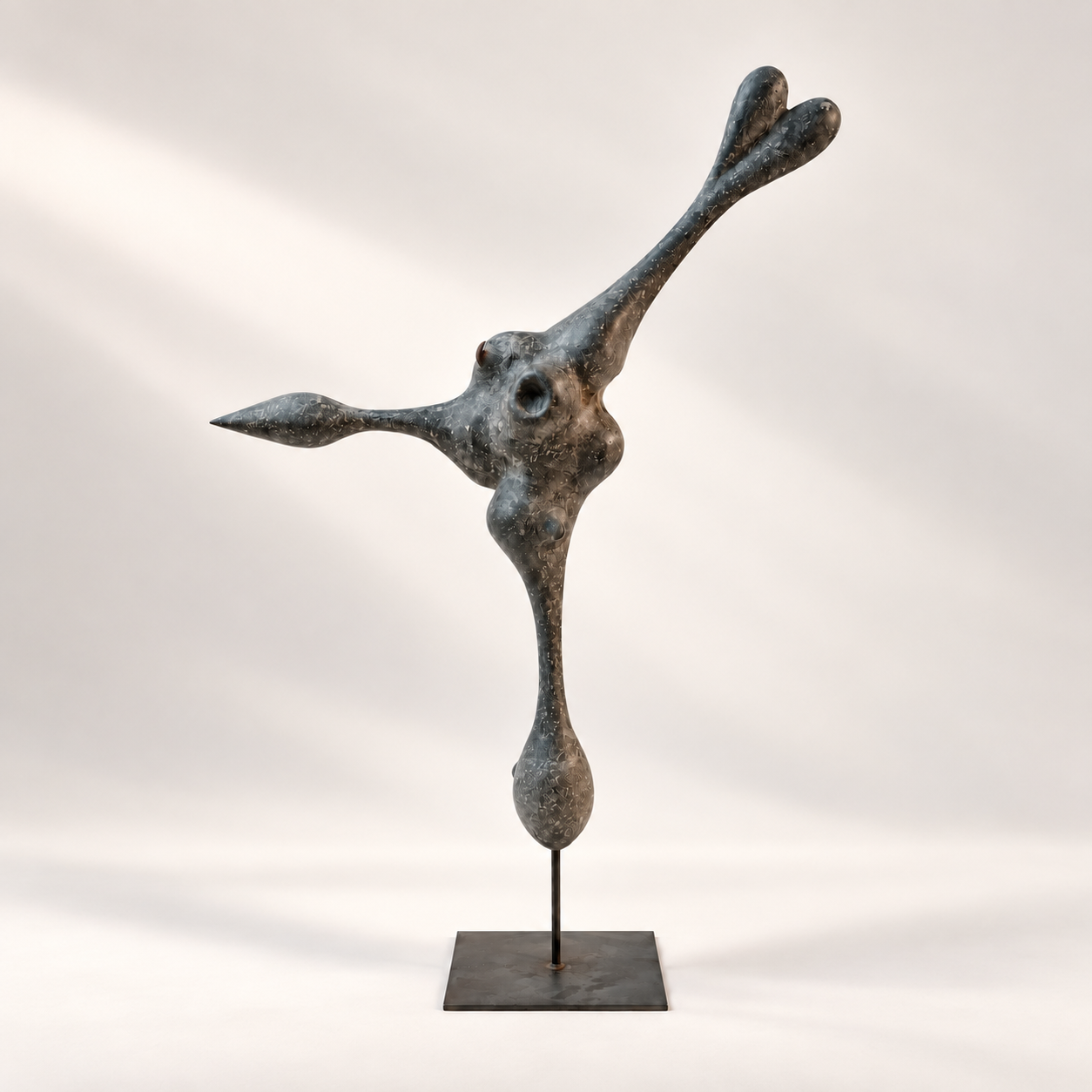 Anthropomorphic slate-grey paper unique sculpture by Justino Del Casar with outstretched arms on a metal stand