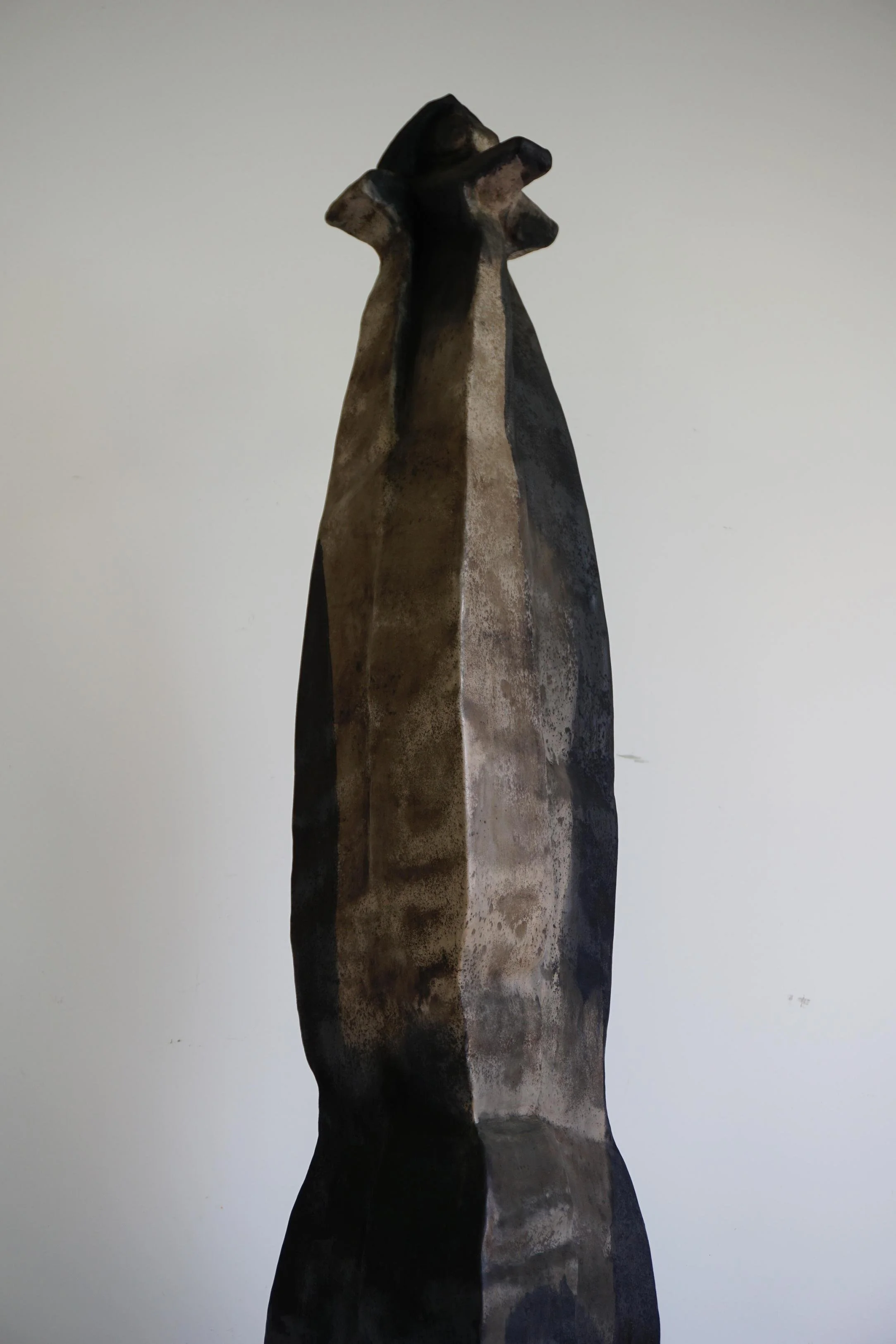 Organic carved lacquer sculpture with architectural silhouette by Ou Tingzhu at EAST WEST SPACE