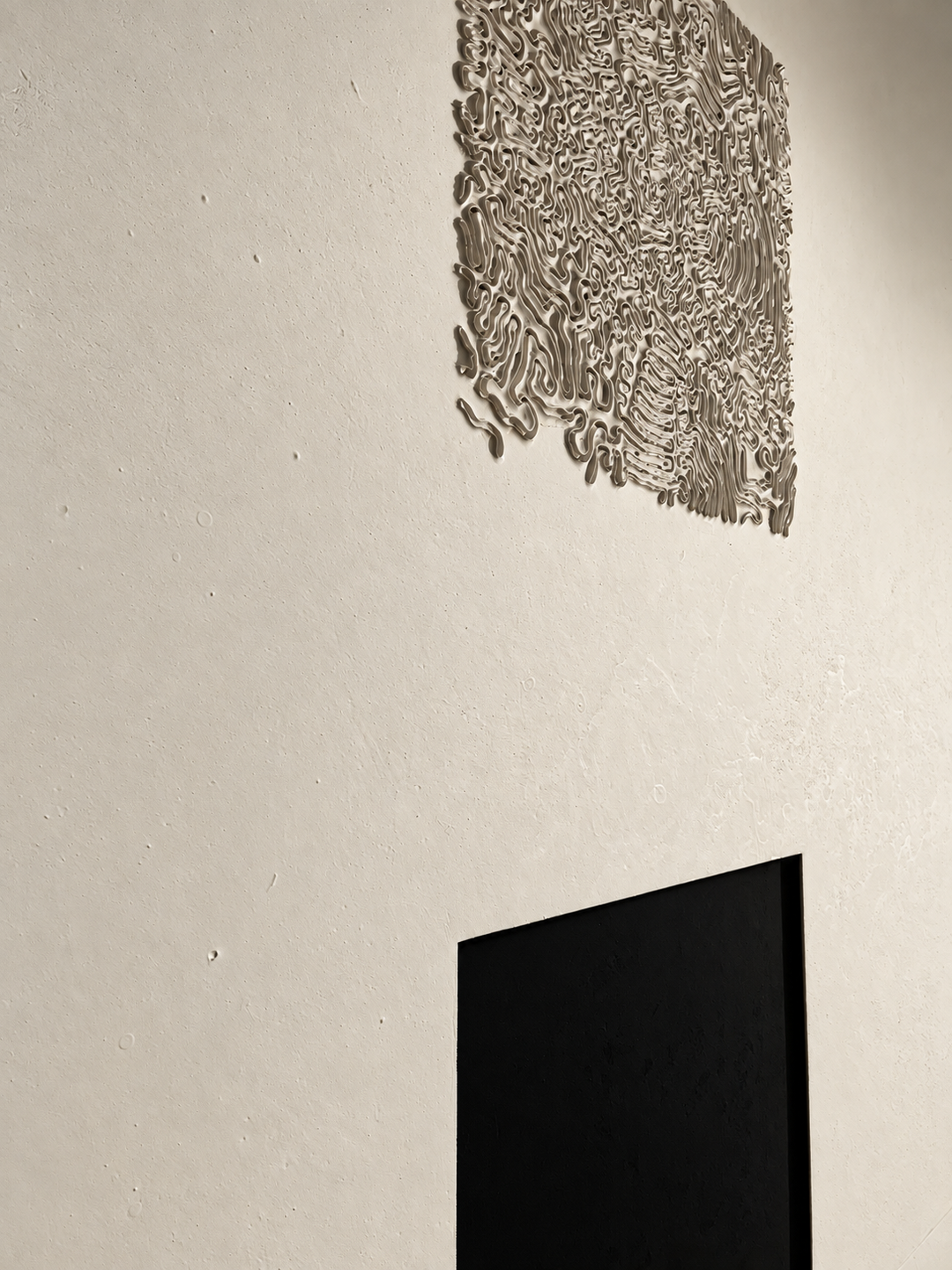 Macro detail of the sculpted organic relief of Black Flame, textured artwork by Robert Pous