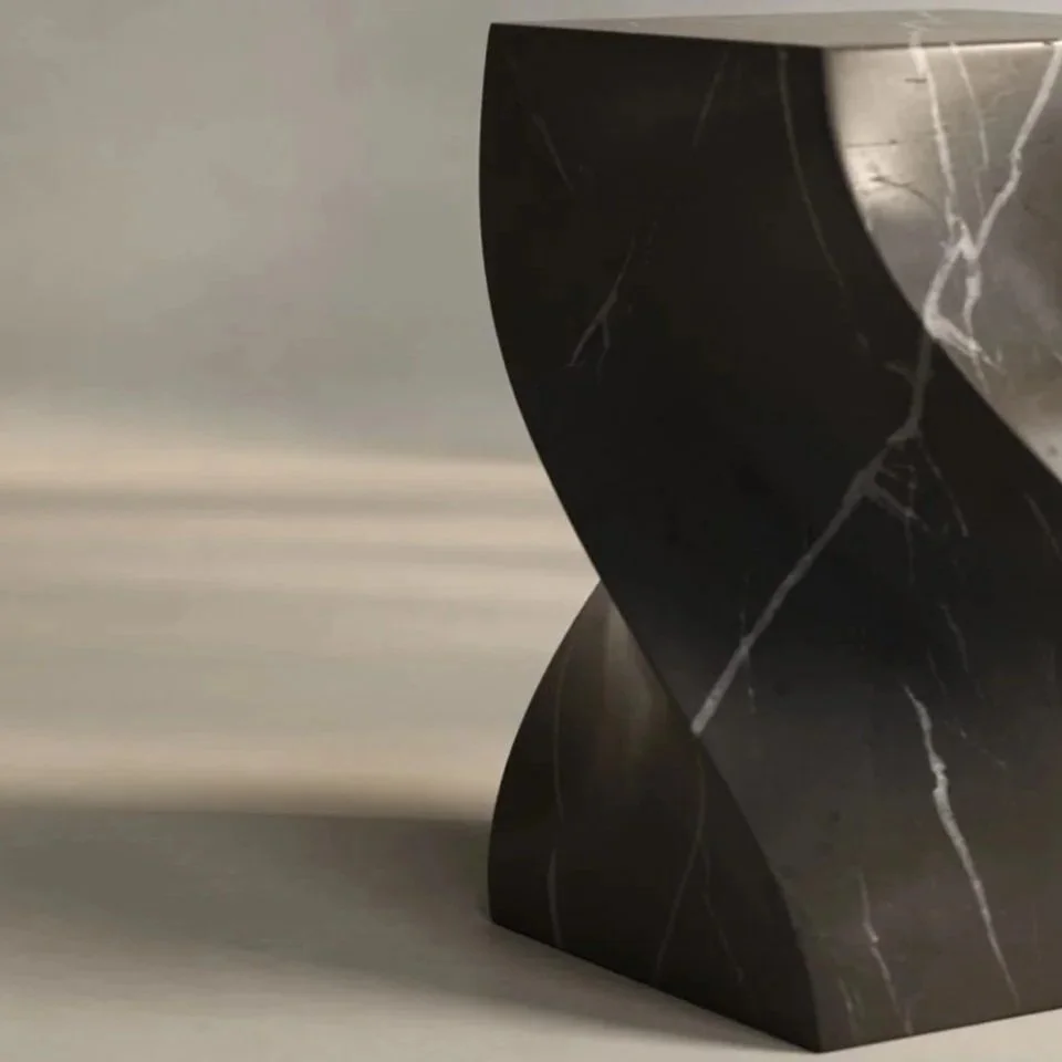 Hand-carved marble Soul Pull Up table by Verónica Mar, modern sculptural design available at EAST WEST SPACE.