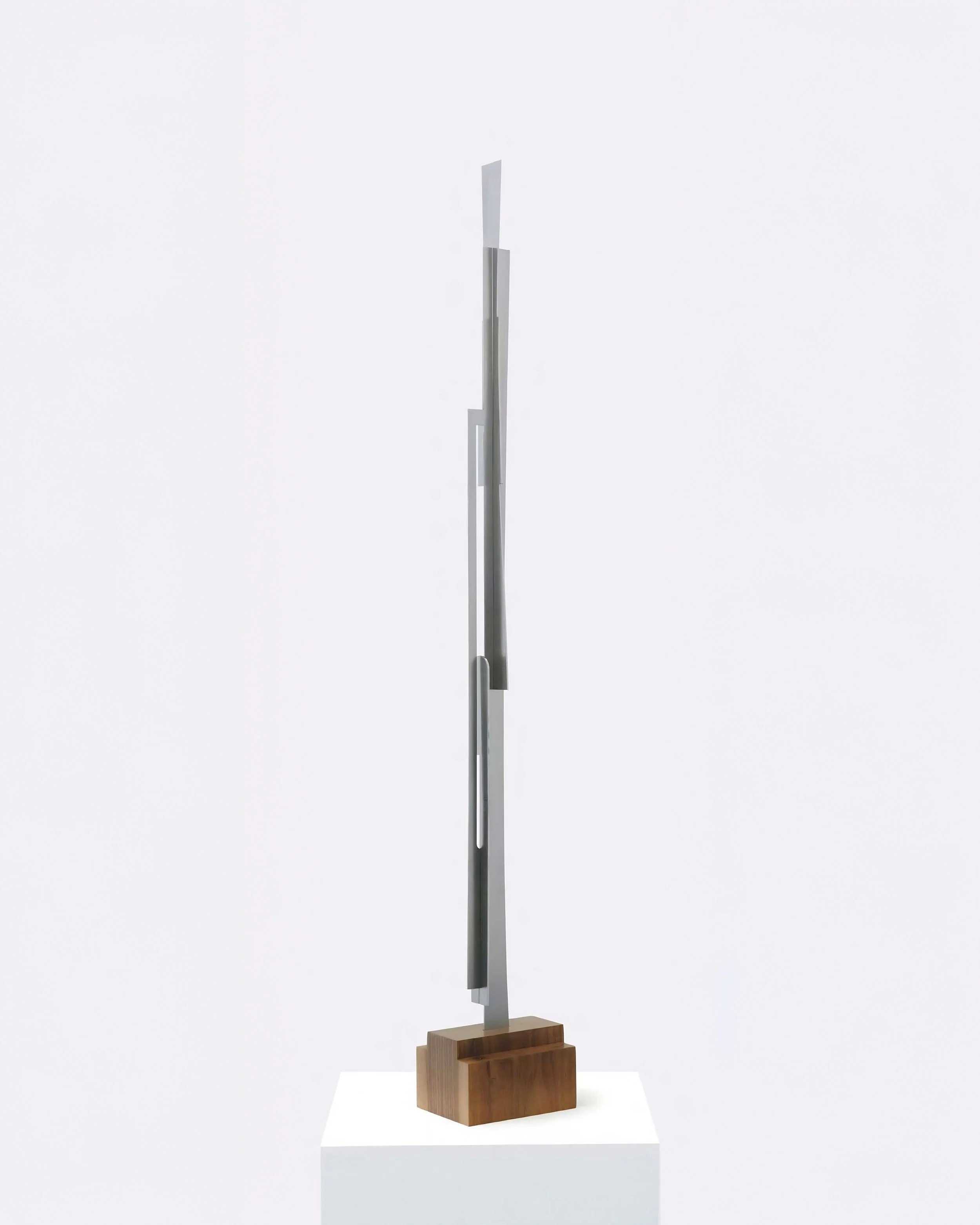 Vertical steel totem sculpture on natural walnut base, Composition Totem N5 by Pablo Leonardo.