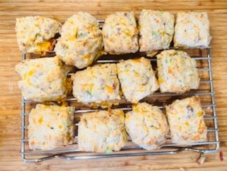 Freshly baked cheddar, scallion and bacon biscuits.