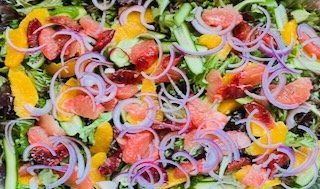Assorted citrus and arugula salad.