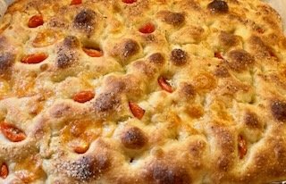 Freshly baked cheese and tomato focaccia.