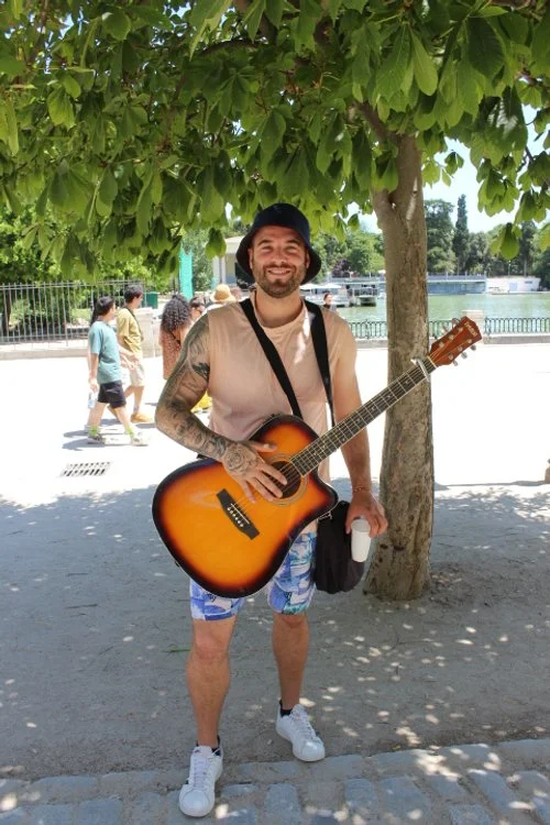 Christian, 35 years old, plays the guitar and sings (sounds really good), originally from Brazil but has lived in Madrid for the past 2 years. He loves getting to know people from everywhere and getting in contact with tourists and loves their intera