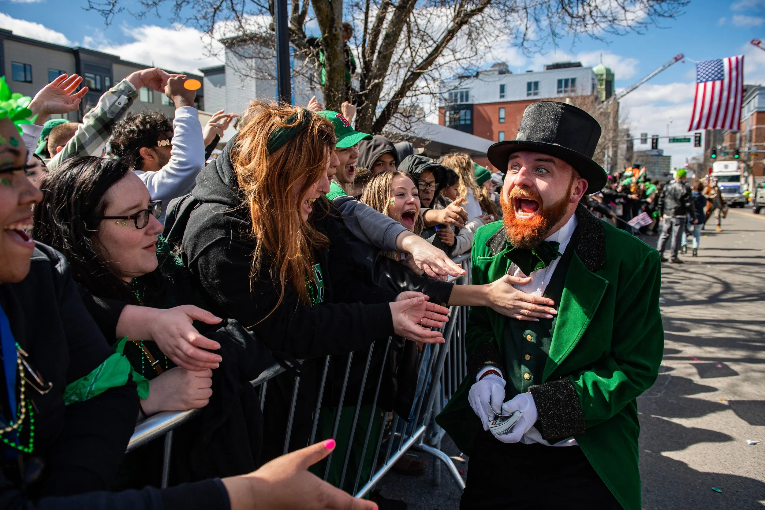 A man dressed as a leprechaun greets revelers during the South Boston St. Patrick’s Day/Evacuation Day Parade on Sunday, March 19, 2023.