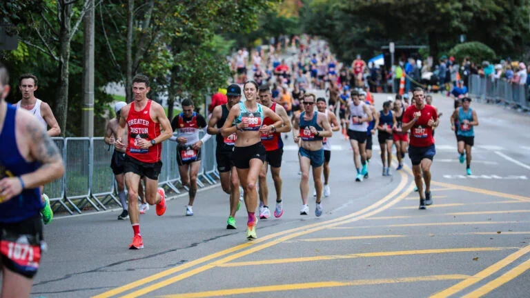 Runners begin the climb up Heartbreak Hill during the 125th running of the Boston Marathon in 2021.