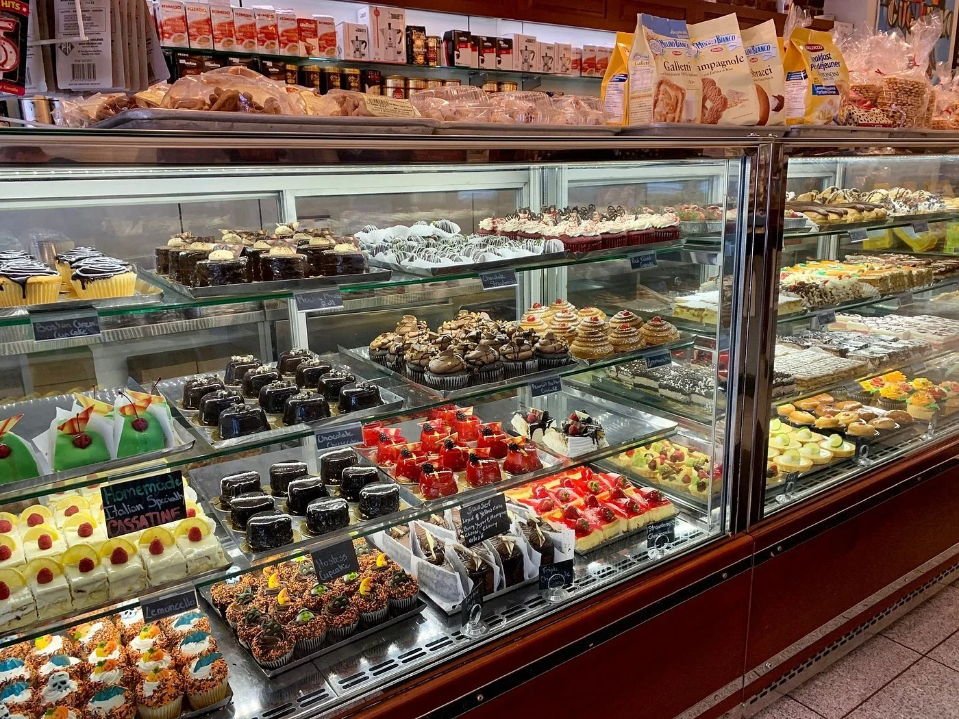 Display case shows a wide selection of Italian pastries and cakes inside the famous Modern Pastry Shop on Hanover Street in Boston's North End
