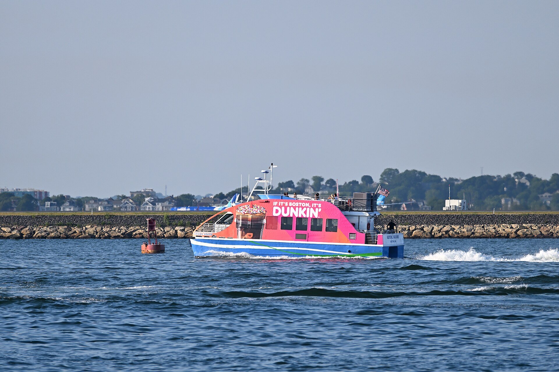 MBTA ferry Abigail Adams, with Dunkin' Donuts advertising, in Boston Harbor