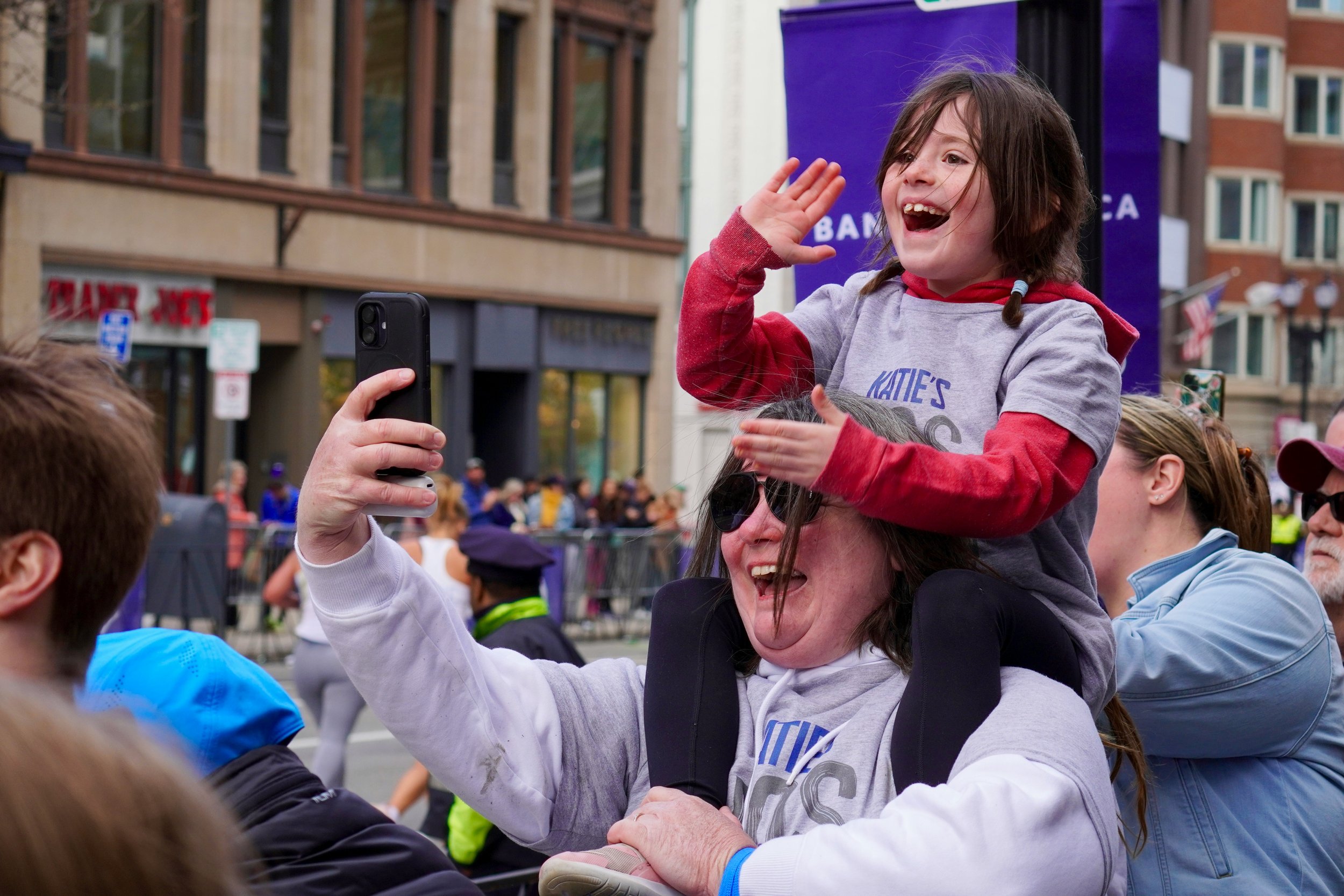 Cheering on runners on the final stretch of the Boston Marathon.