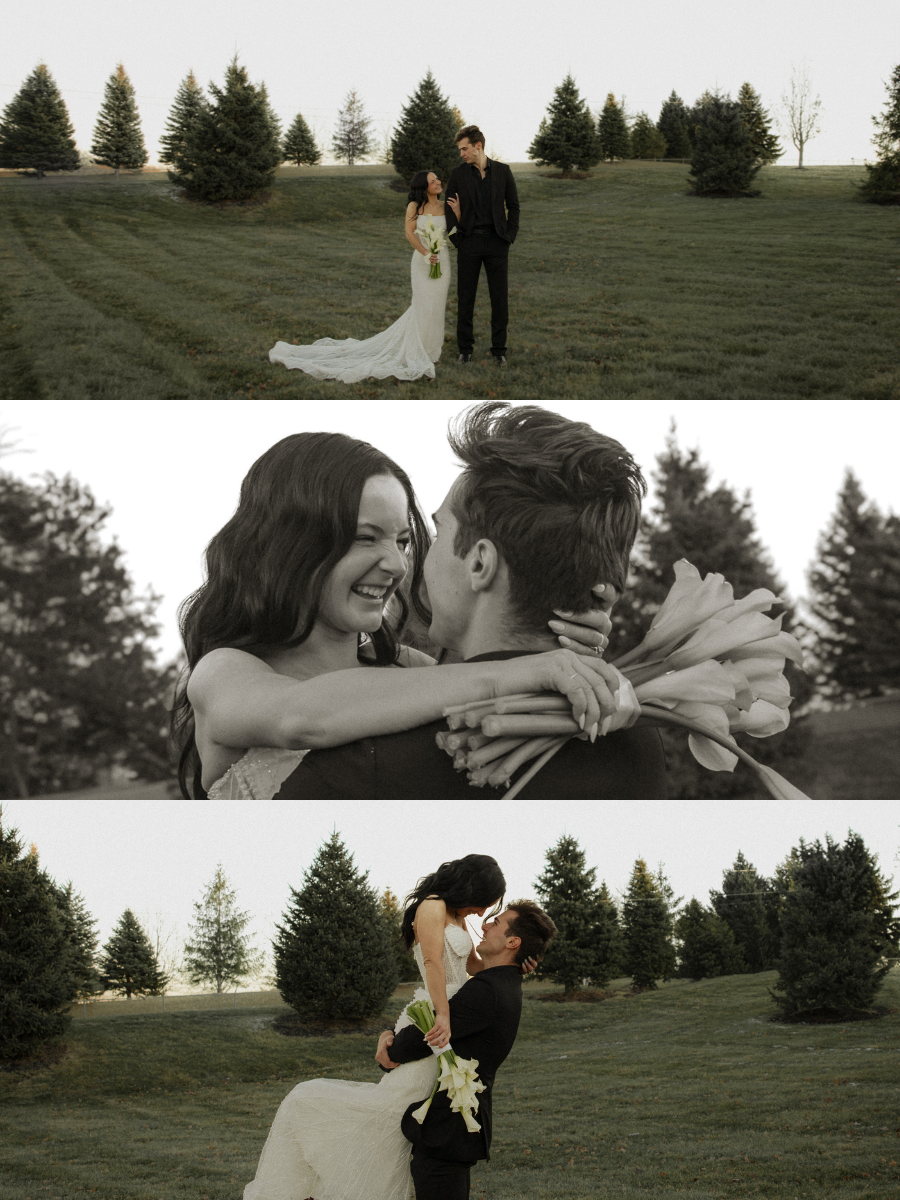 A couple in wedding attire celebrating outdoors with trees in the background, smiling and embracing.