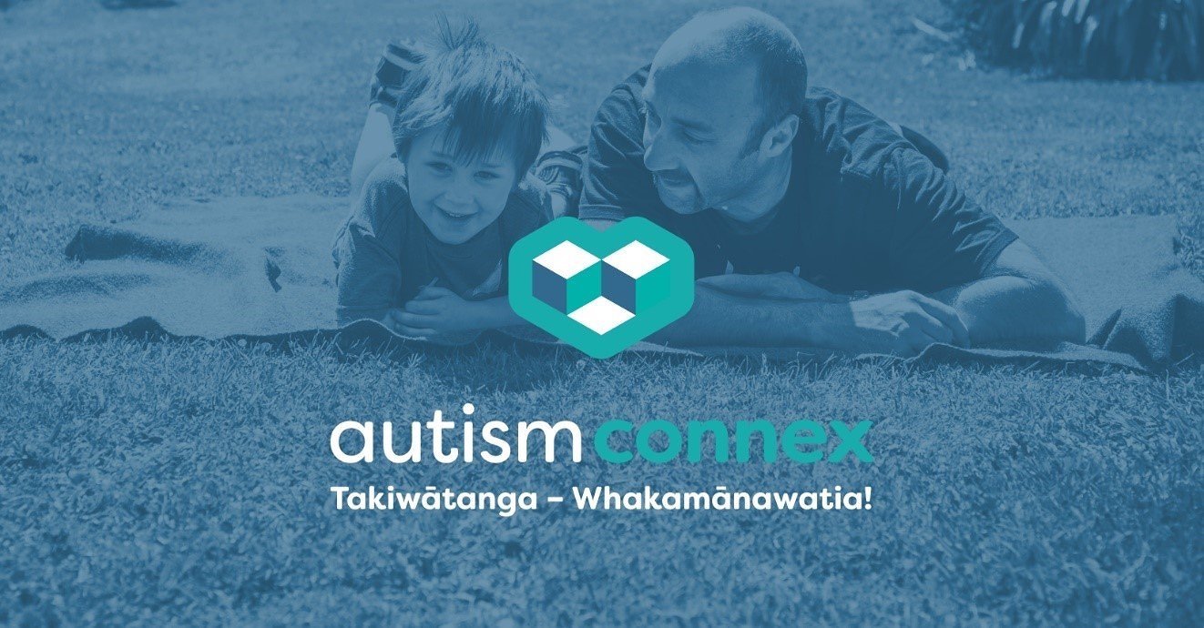 A child and an adult laying on the grass outdoors, smiling at each other. The image features the autism connex logo and the text "Takiwātanga – Whakamānawatia!"