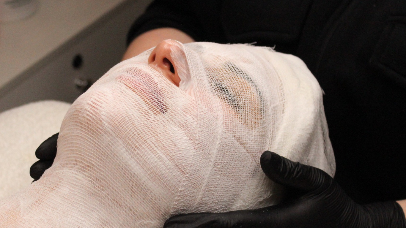 Delicate guaze drapes over a woman’s face in anticipation of the MBR Algae Mask treatment at a San Francisco spa.