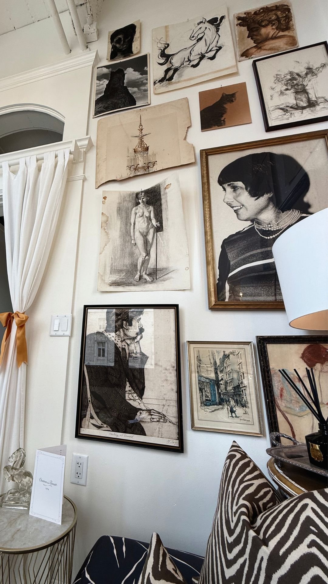 Sunlight fills the spa lounge adorned with French and Parisian artwork, offering serene views of Nob Hill rooftops in San Francisco’s elegant urban oasis.