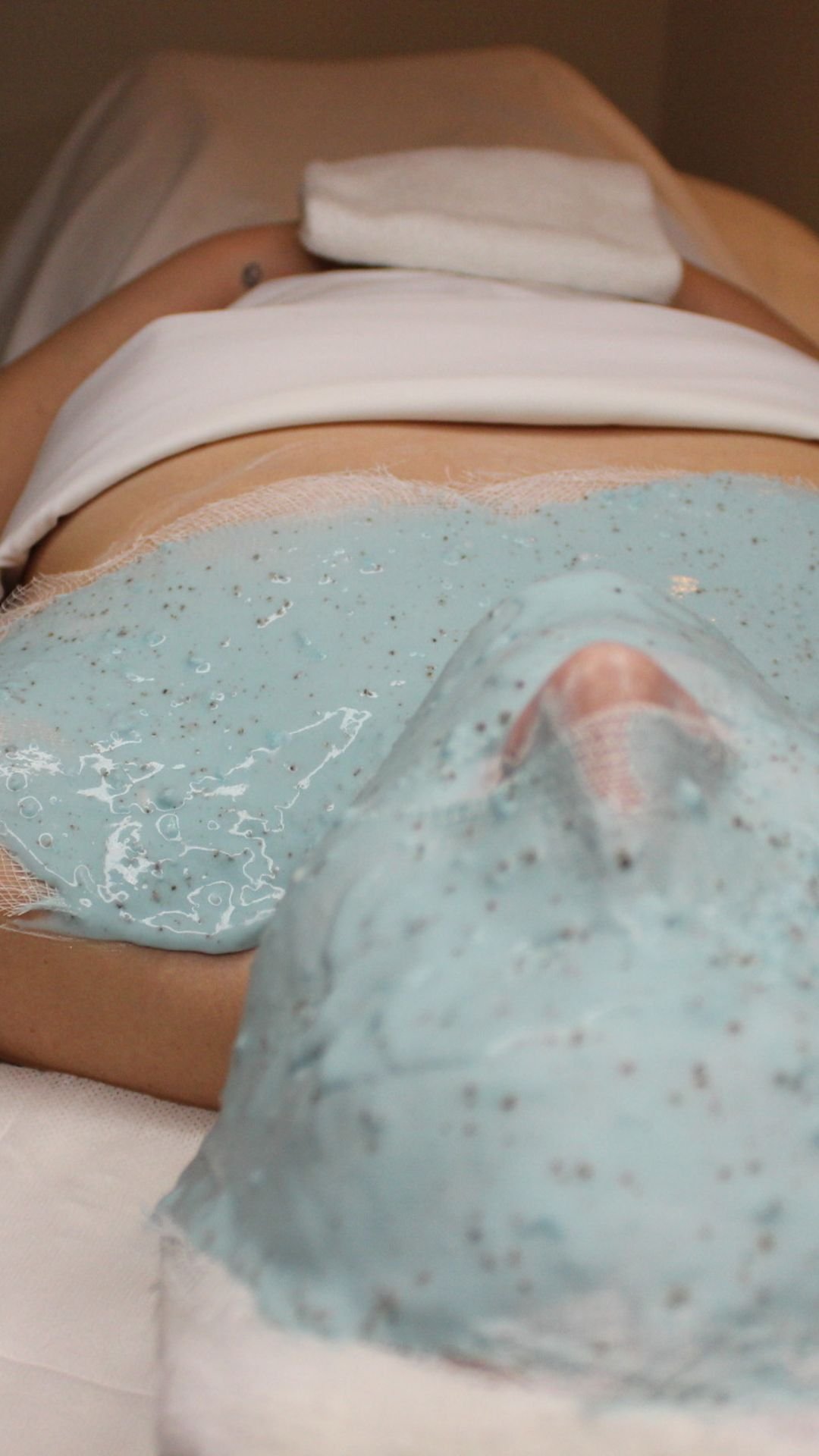Woman relaxing with a rejuvenating MBR Algae mask at Chateau de la Beauté spa
