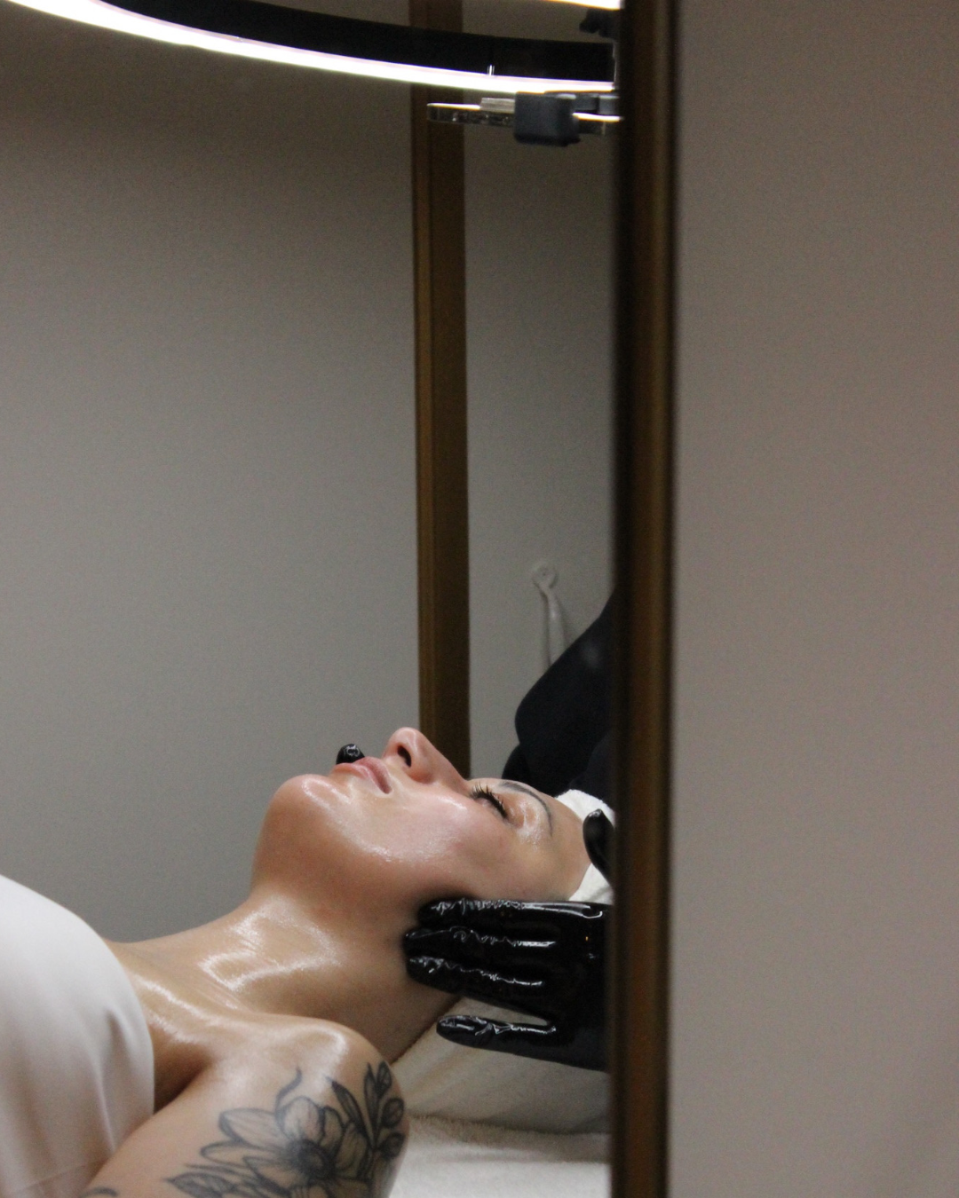 A guest experiencing the tranquility of a Biologique Recherche facial.png