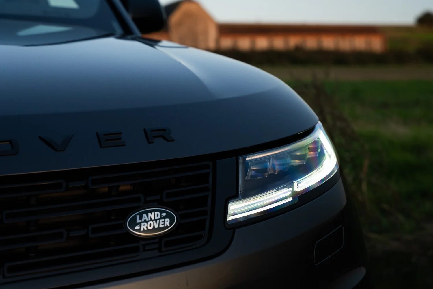 Range Rover badge and headlamp in natural light