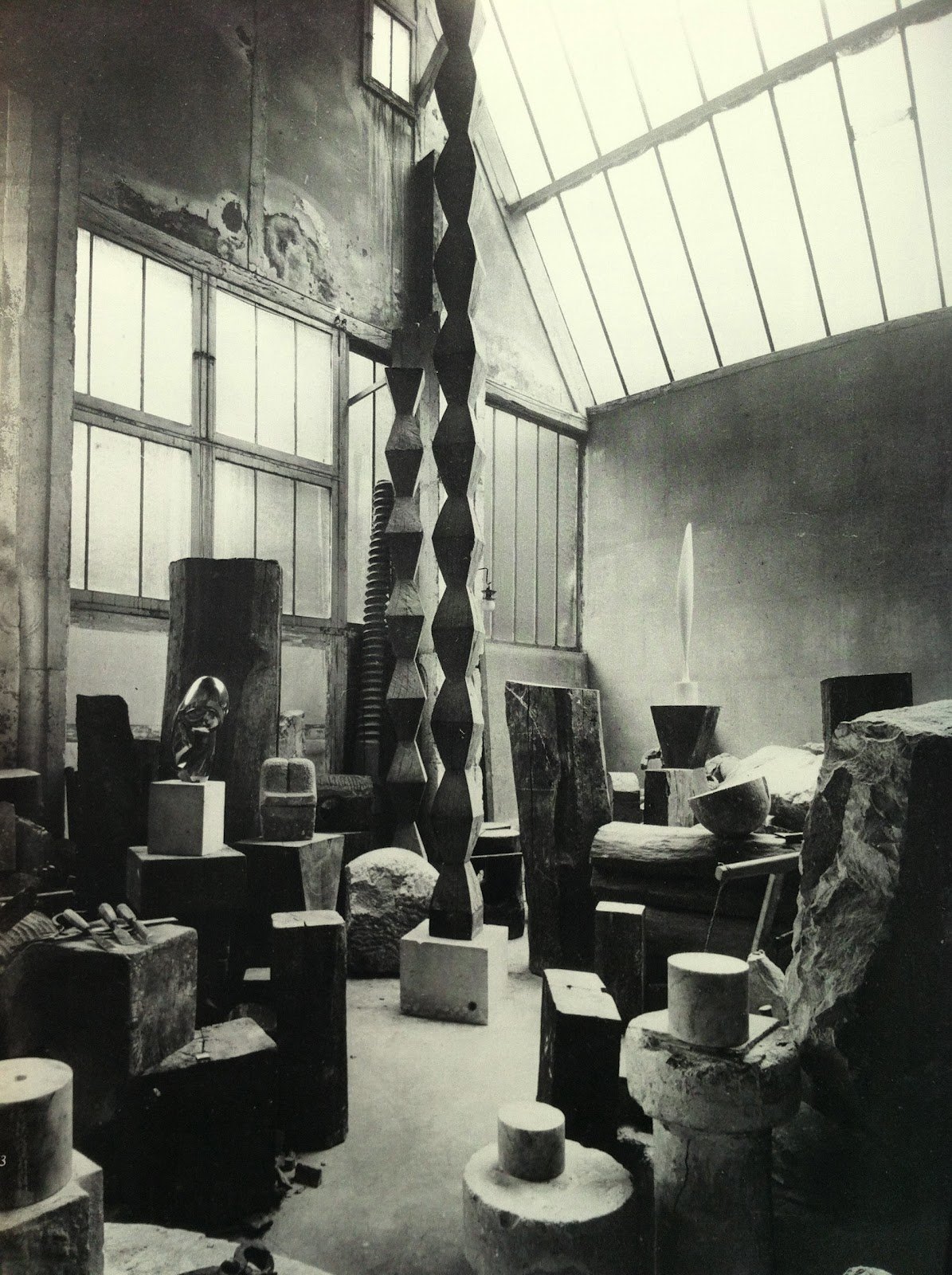 Artist's studio with various sculptures and art materials