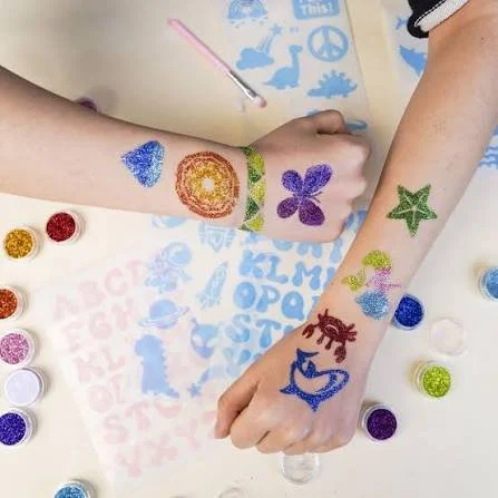 glitter tattoo, face painting