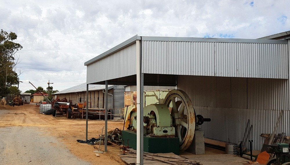 Crossley motor and other old machinery, tools, and some construction materials,