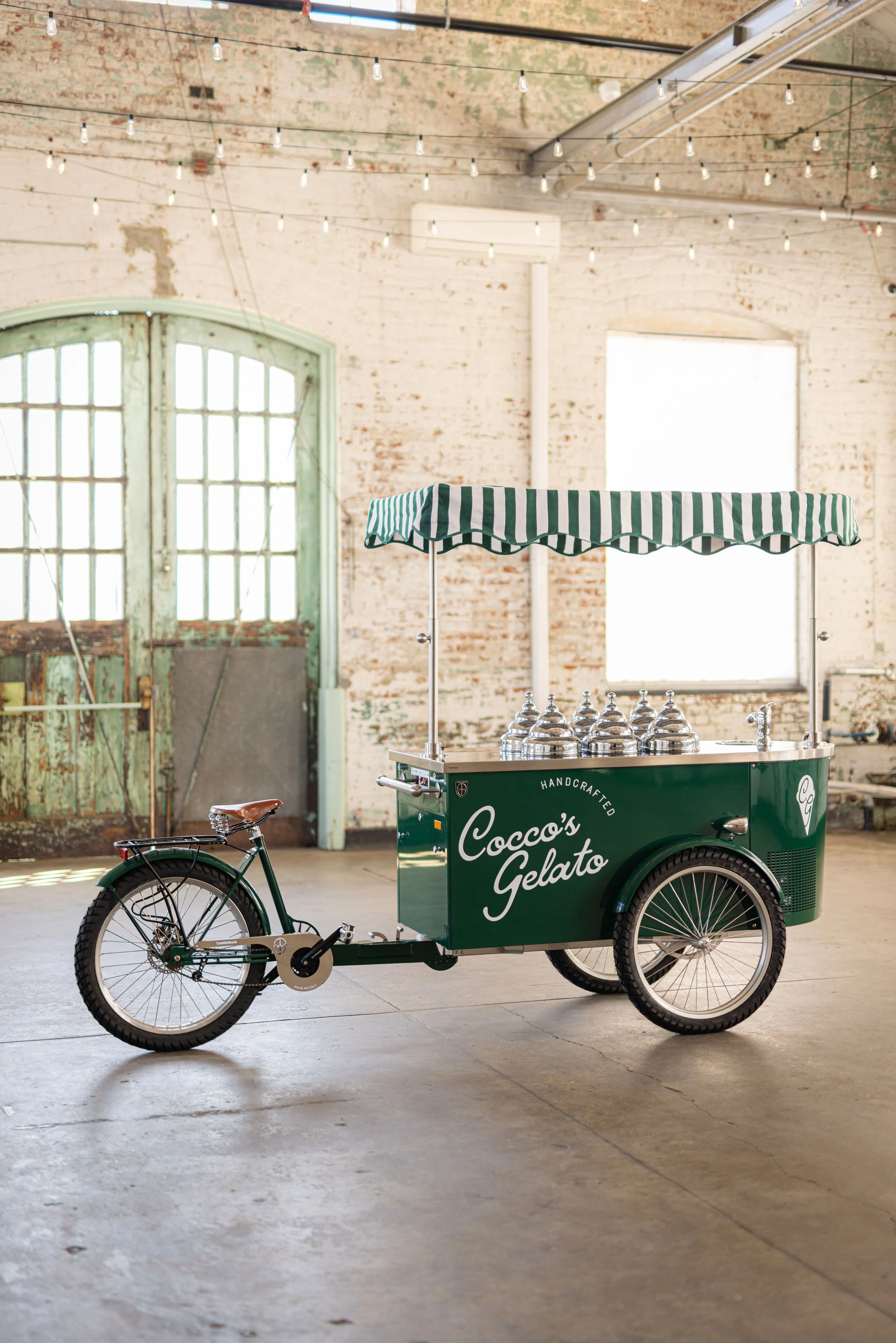Green bicycle with a gelato cart attached, labeled