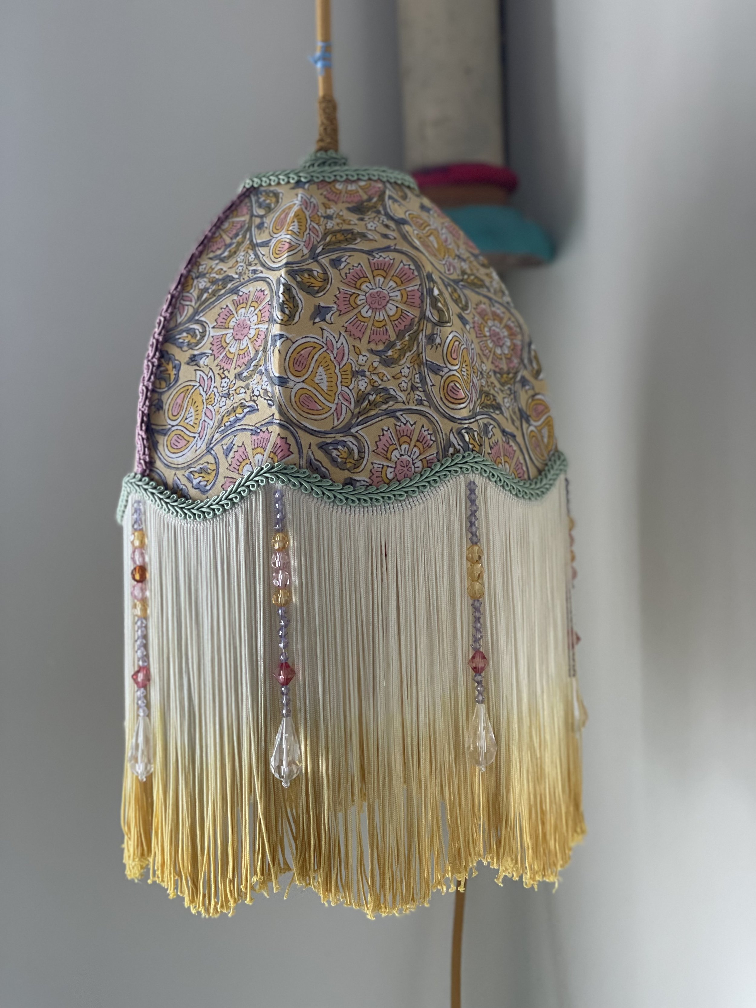 Scolloped 8" dome in block print with dip dyed fringe.