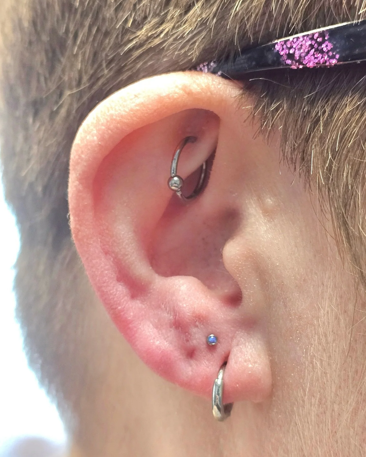 Thank you so much for coming in, Andrea! It&rsquo;s always so great to see you! 

Curated, high lobe with 2.5mm purple pink synthetic opals bezel set in implant-grade titanium. 

@piercingsbycourtney  @dandyandie 

To schedule a piercing, change out,