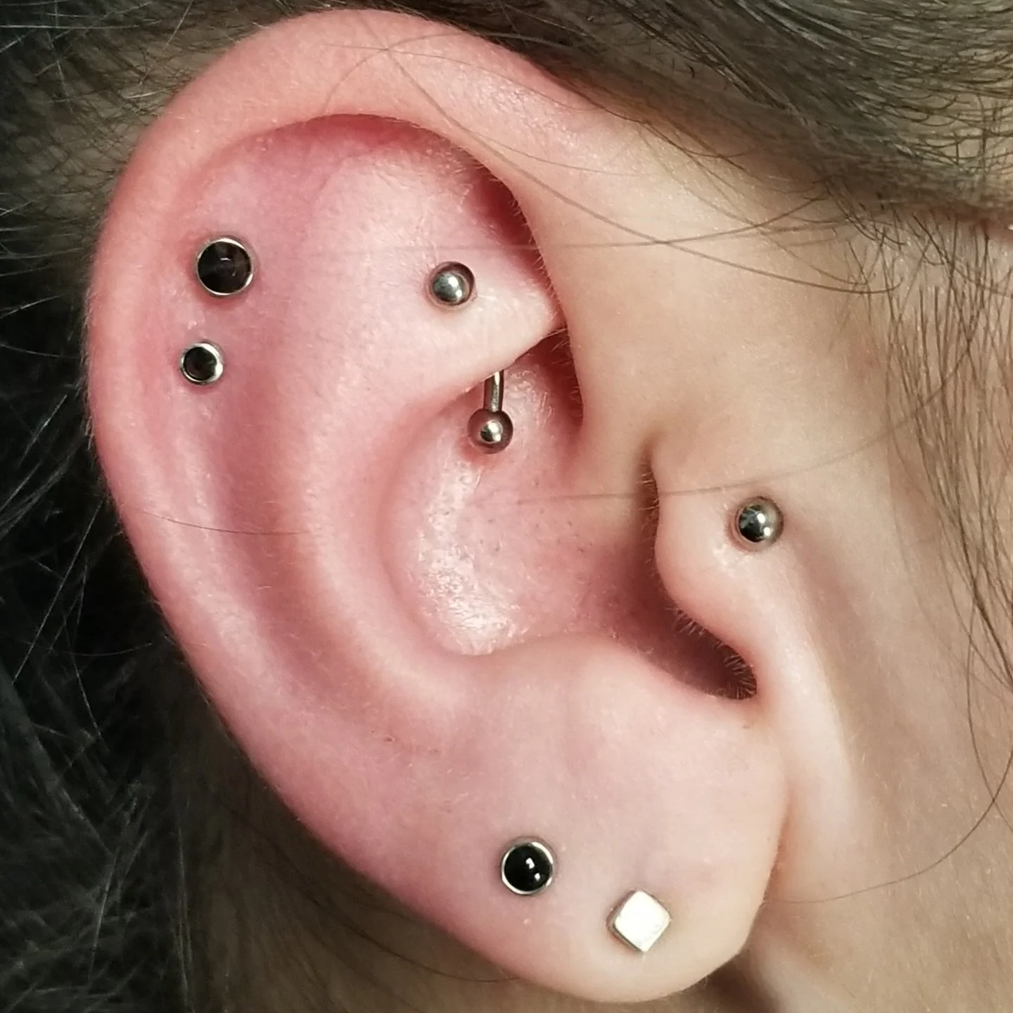 Clockwise: Rook, tragus, 2nd lobe, and double helix piercings. All pierced using implant grade titanium with titanium beads or graduated 2mm and 3mm black Swarovski stones. 

@piercingsbycourtney

To schedule a piercing, change out, or to purchase je
