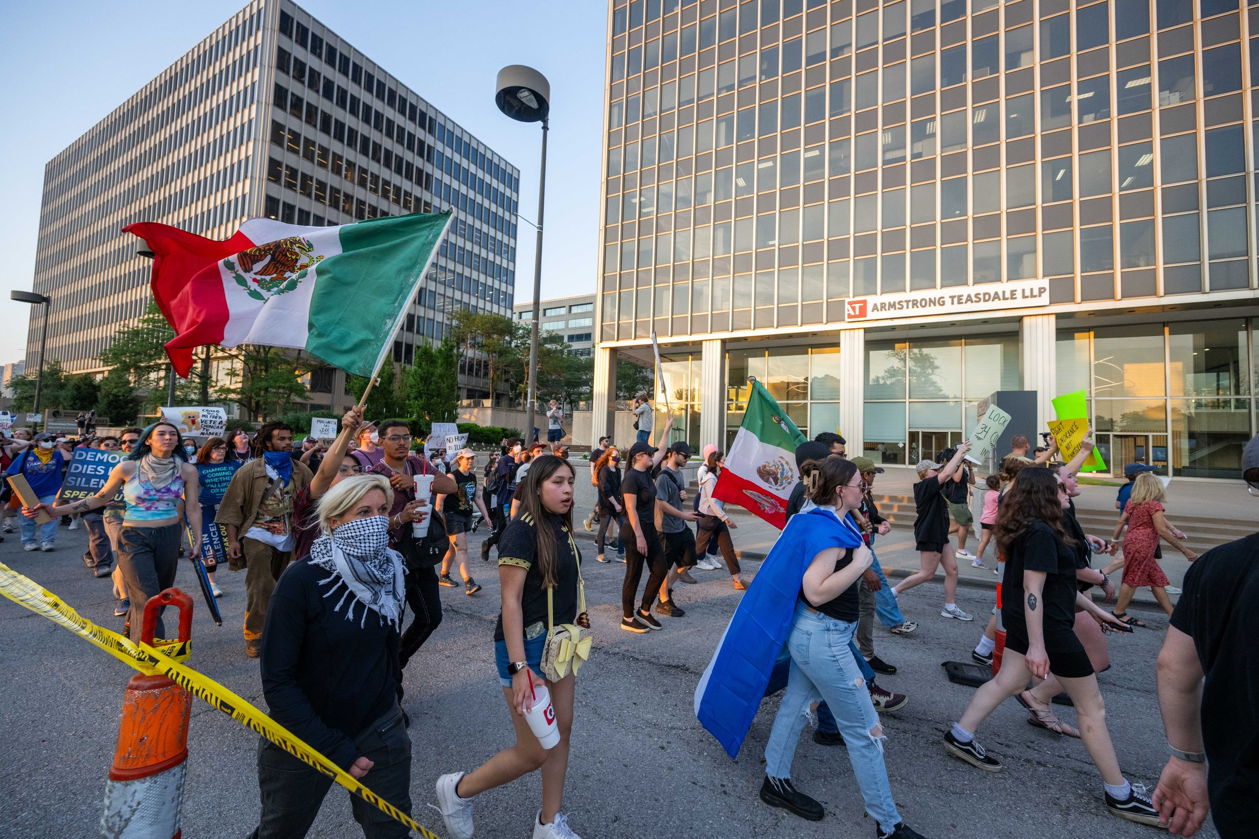 A protestor waves a Mexico flag